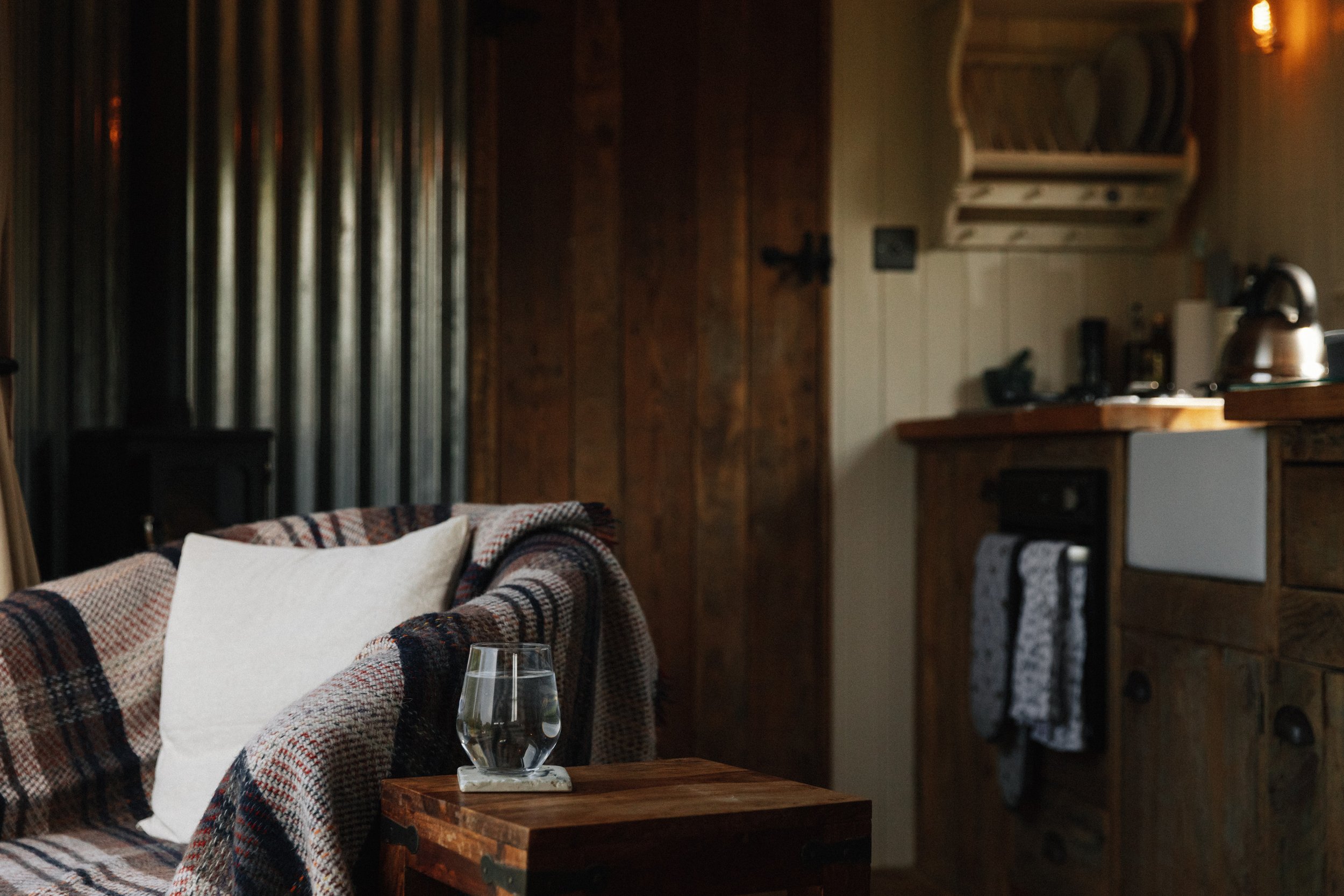 A cosy wooden cabin interior with armchair