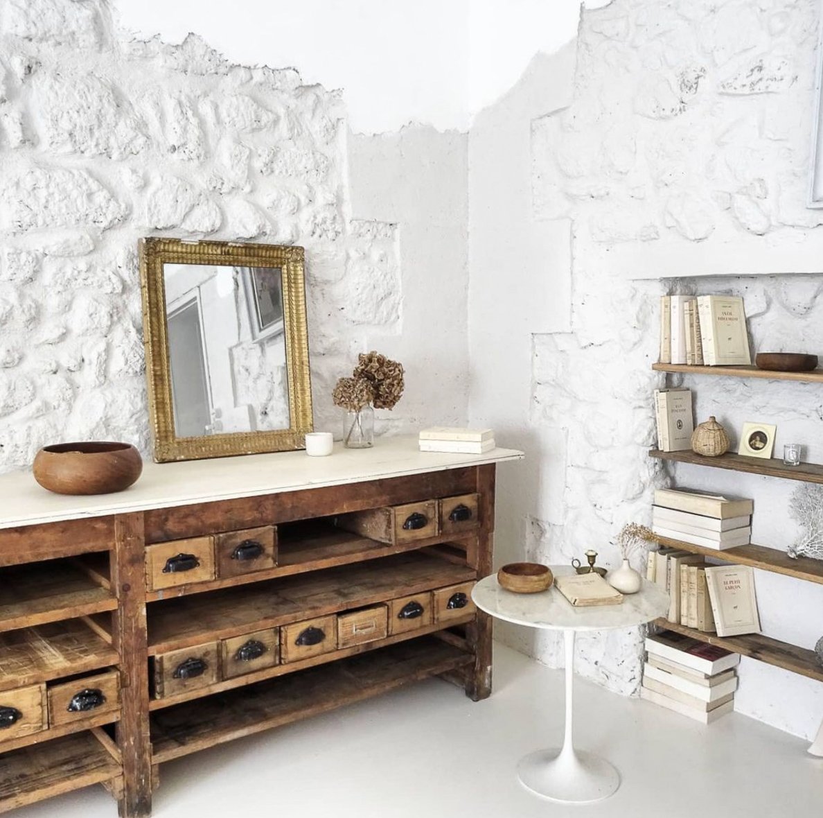 White interior with old wooden drawer unit and other vintage finds