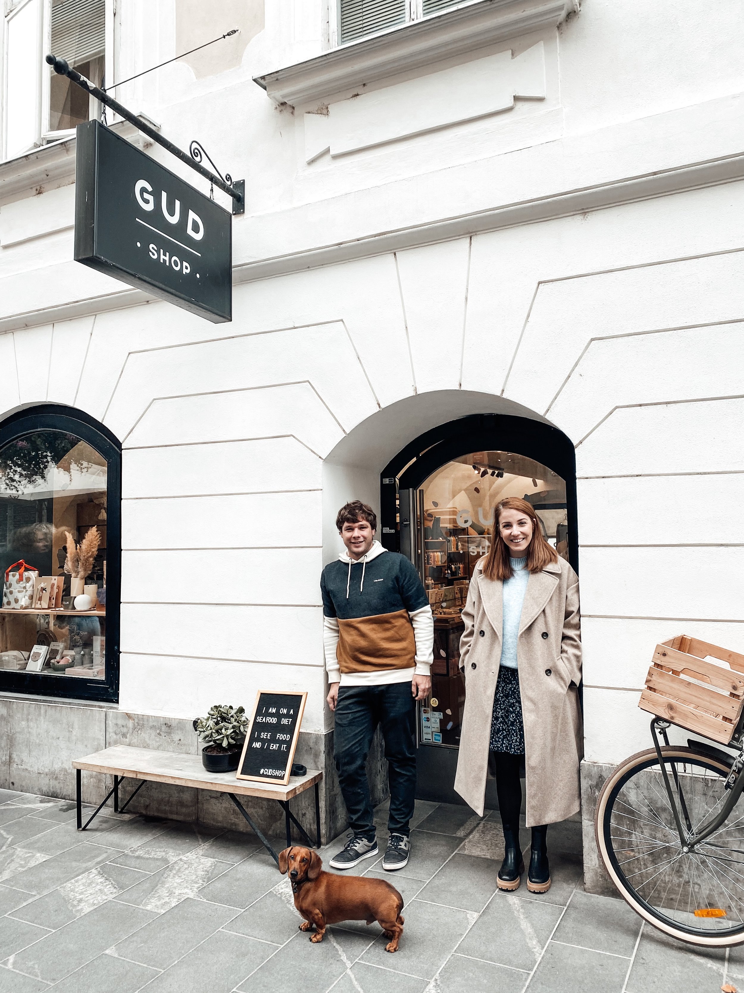 shop owners of Gud Shop in Slovenia with sausage dog