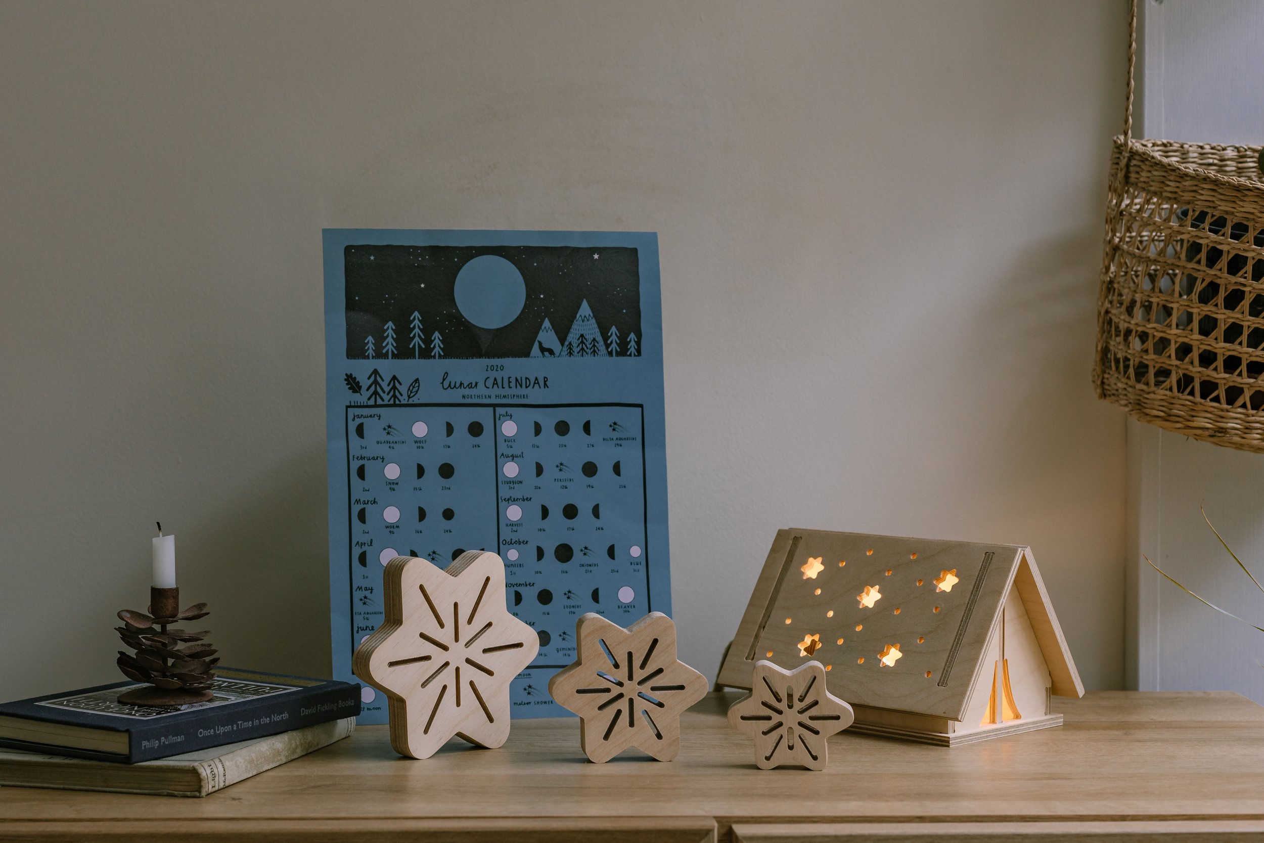 tabletop with plywood decorations and ten-shaped plywood light