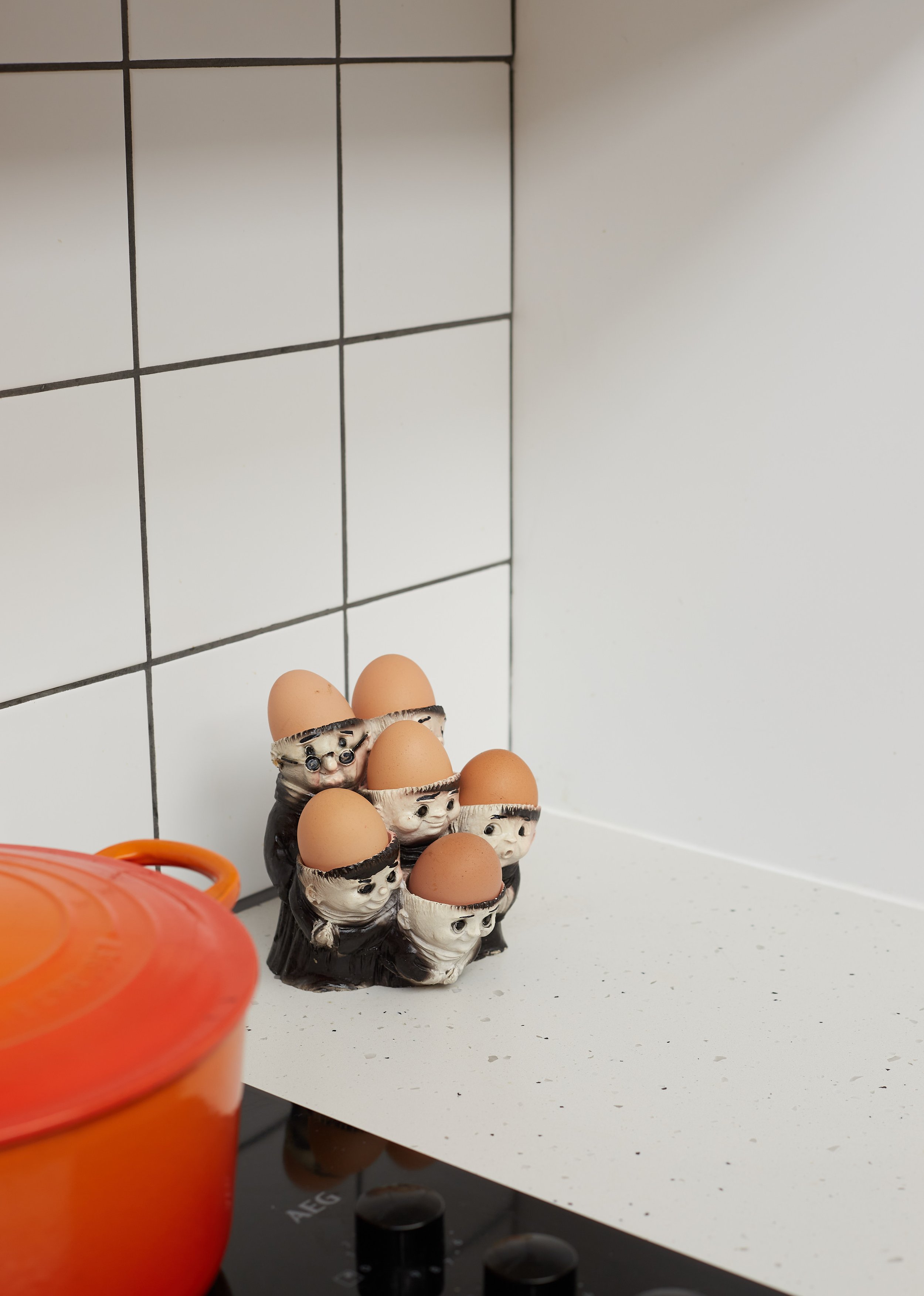 vintage monk head egg cups in kitchen