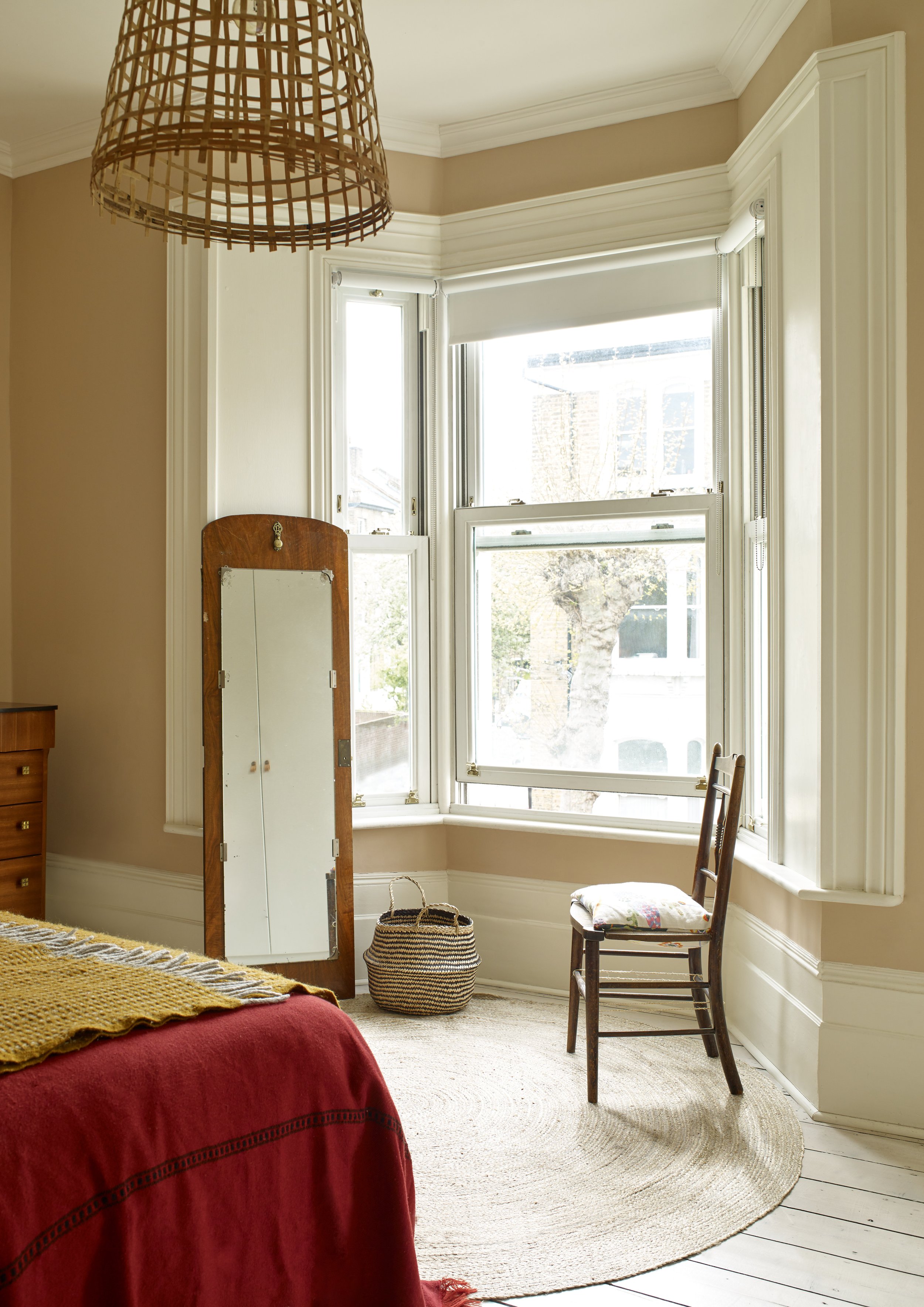 Bay sash windows in a calming bedroom