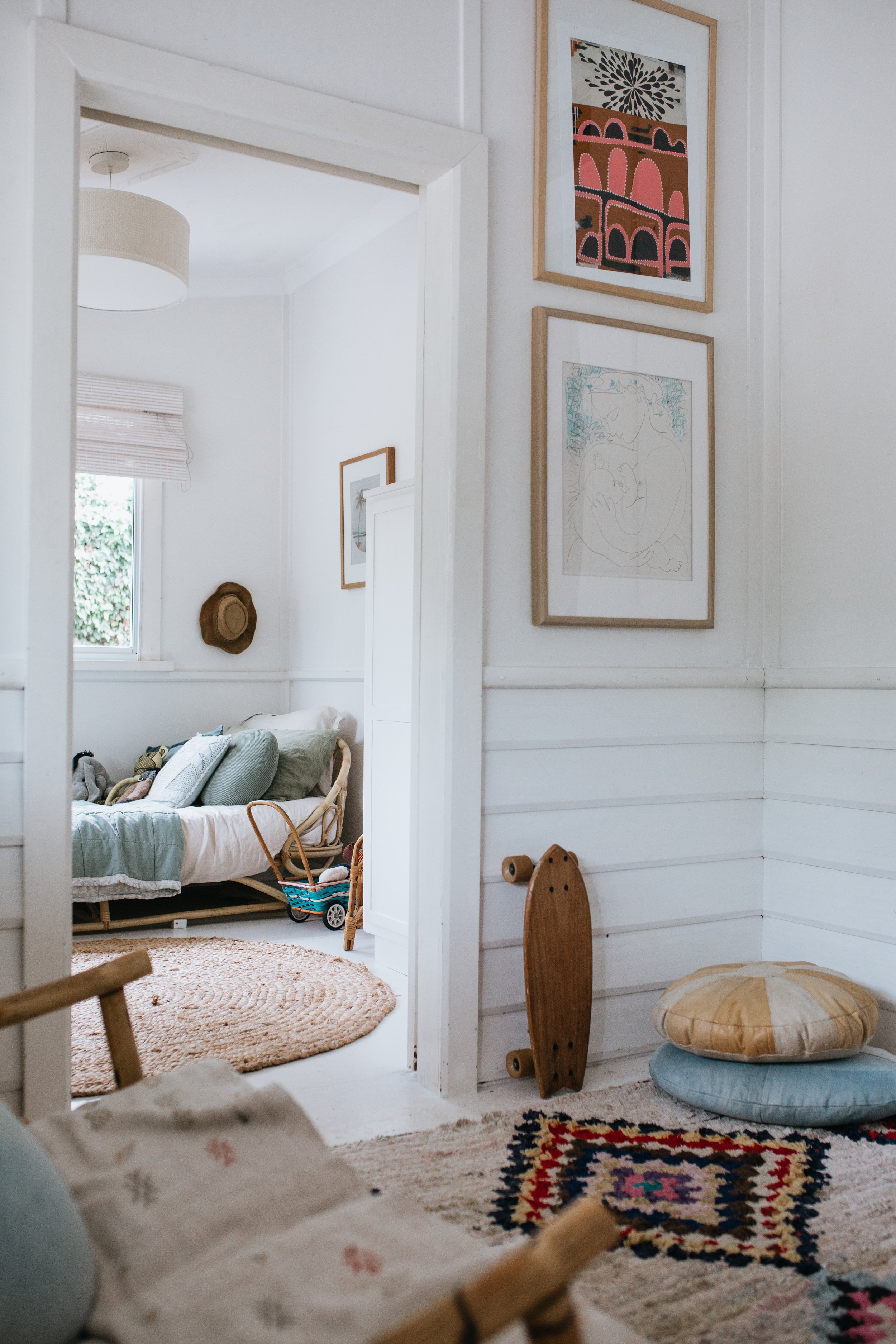 Homespun style interior looking through doorway to child's bedroom
