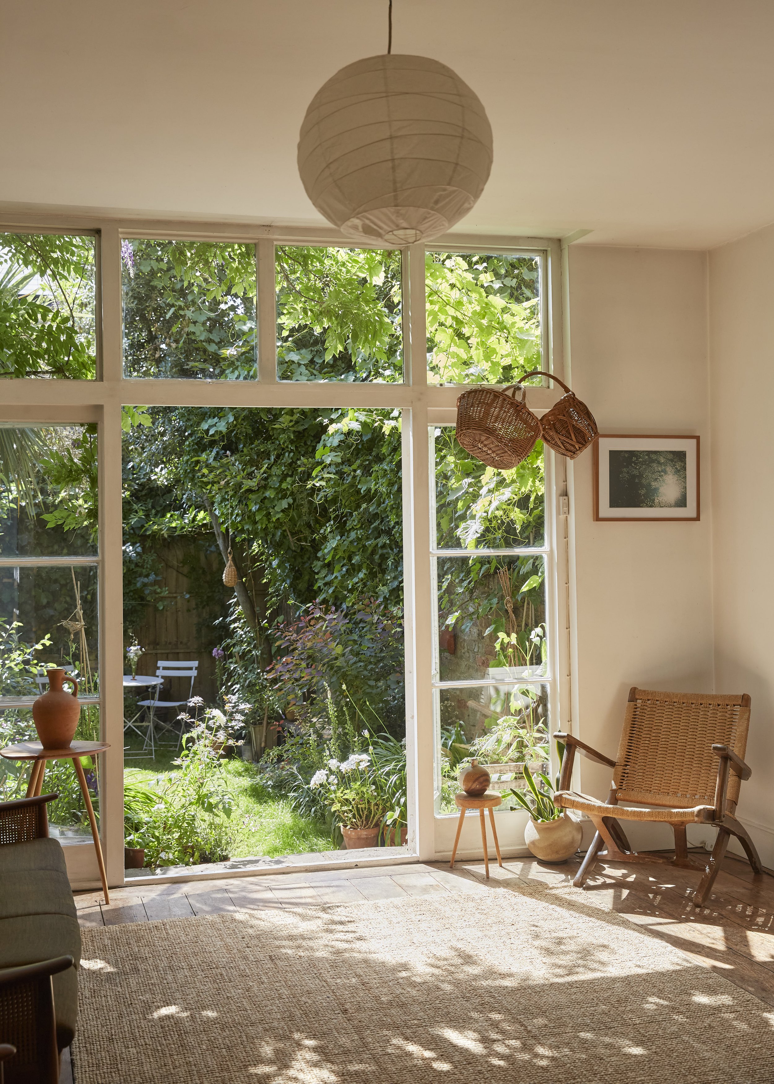 Sun filled room with view into garden, decorated with vintage and handmade items