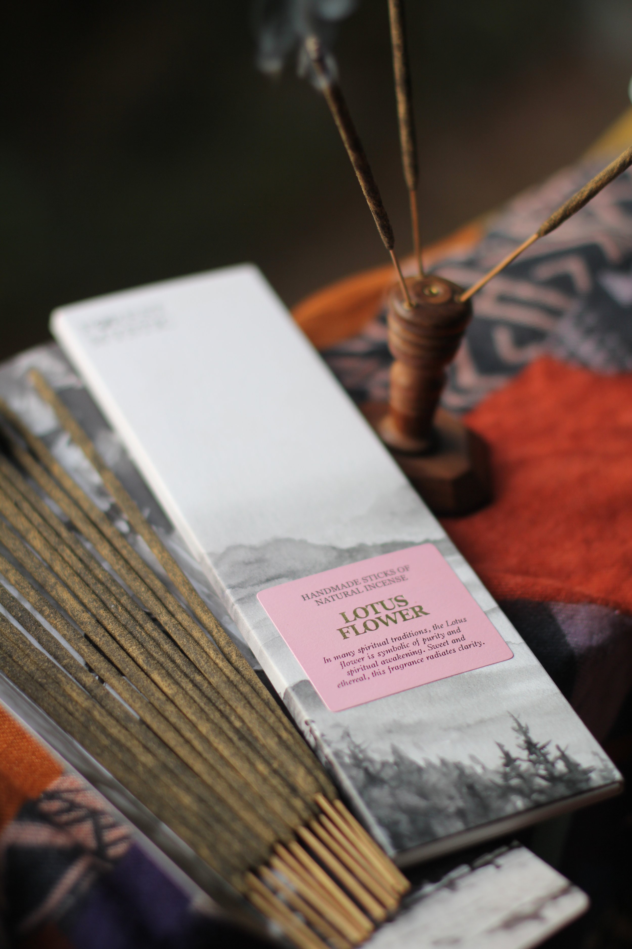 Pack of Lotus Flower scented incense sticks open on table