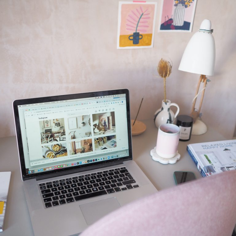 laptop with 91 Magazine Instagram on screen in creative studio