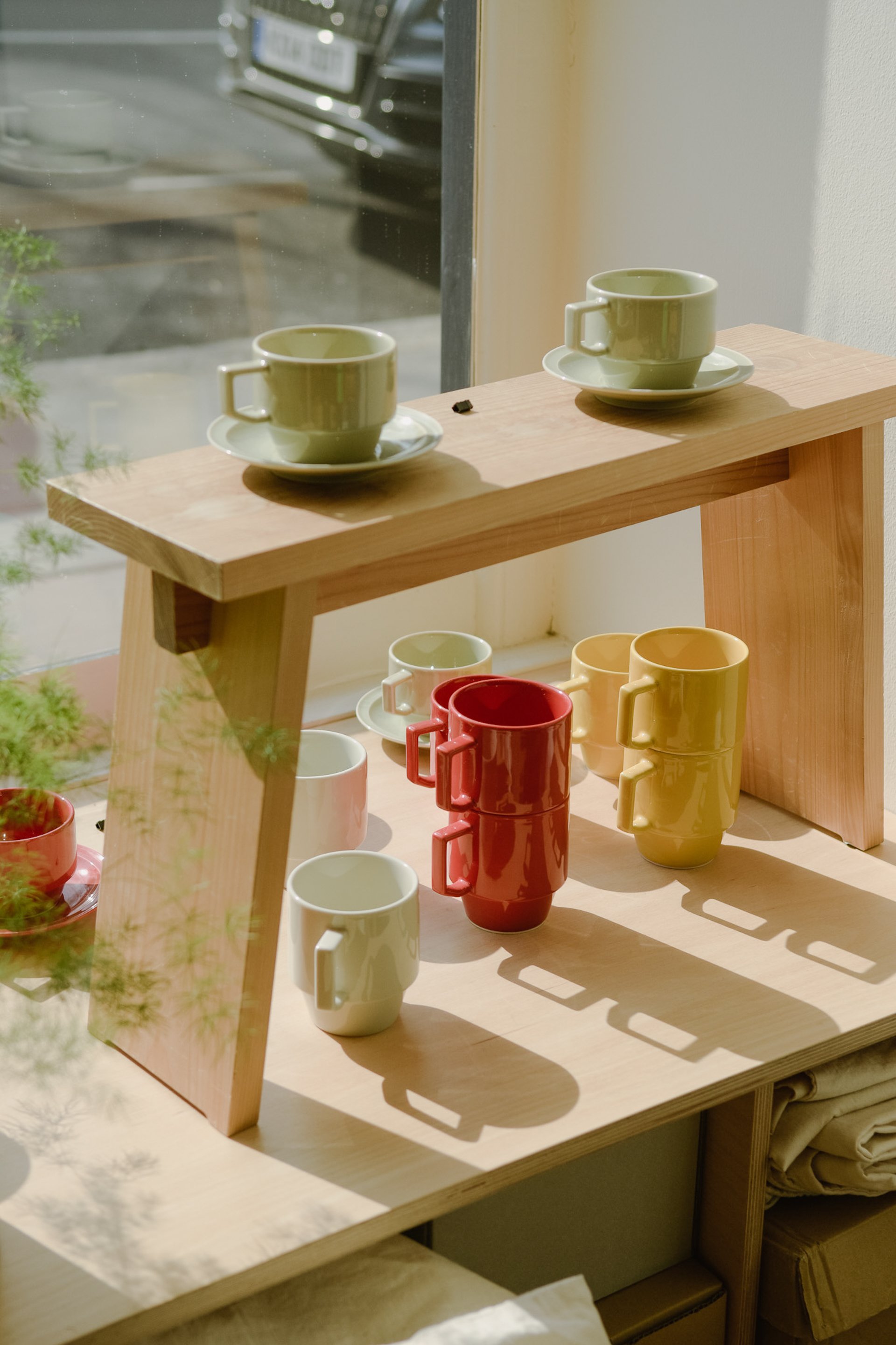 Colourful ceramic mugs on display in Japanese store, Native and Co, London