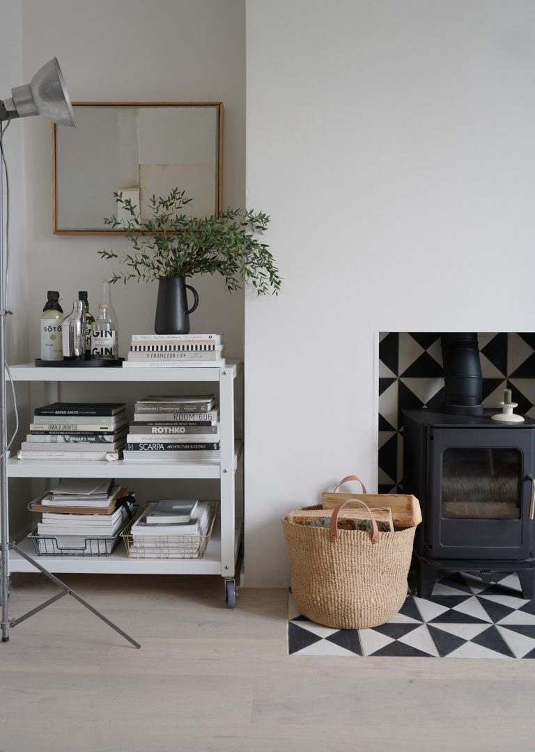 Minimalist shelves inside neutral living room of Cate St Hill