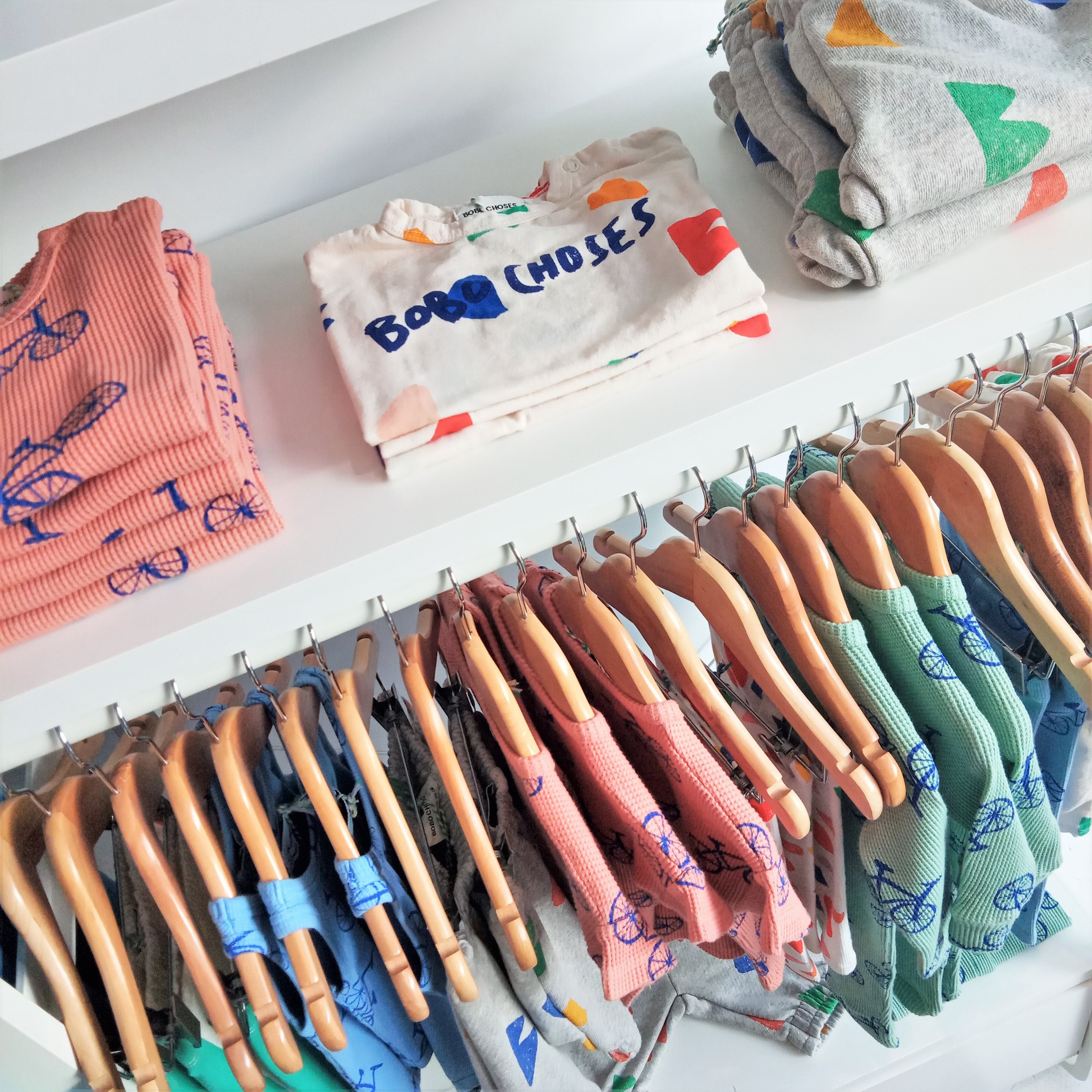 Bright kids clothes inside independent childrenswear store Trapeze Kids, Sheffield