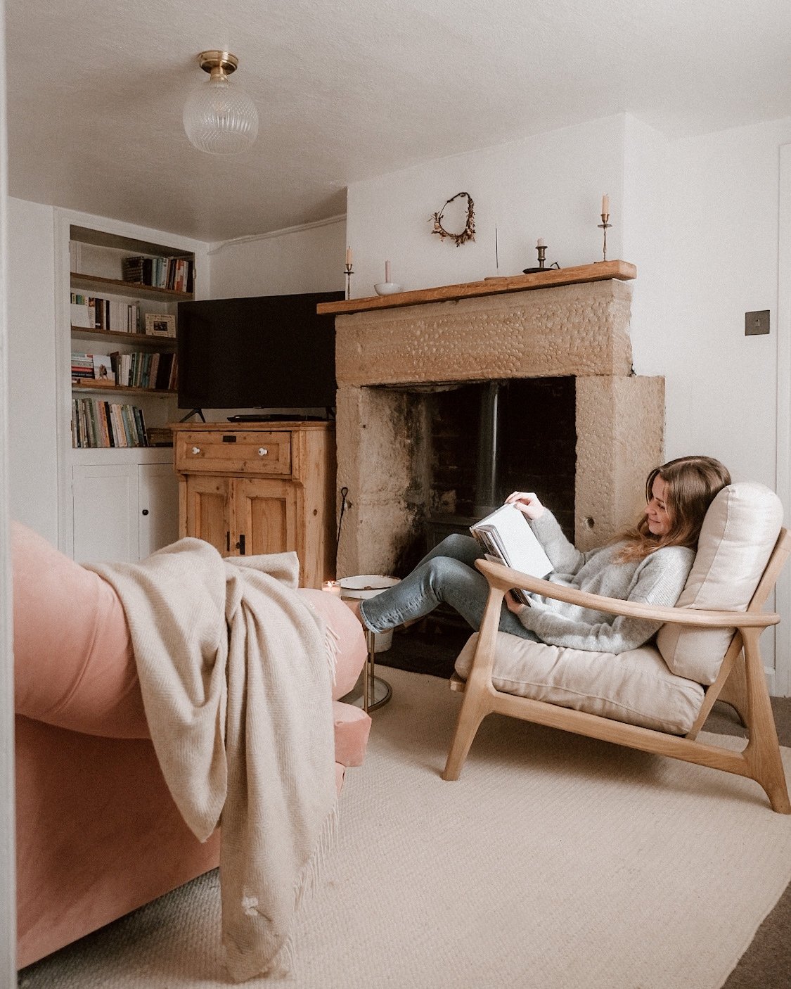 Jessica Rose Williams reading in living room