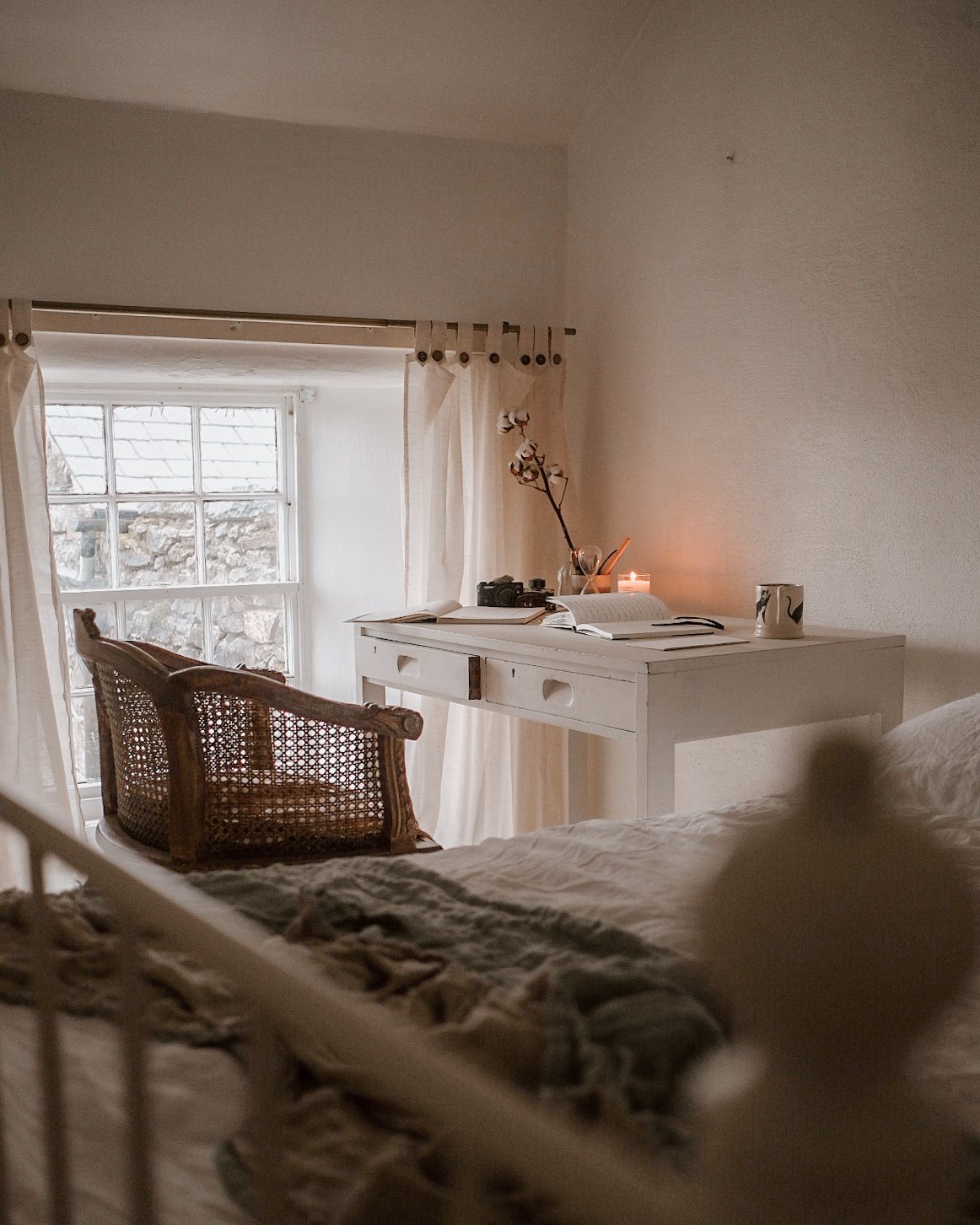 Calm bedroom with small desk area in corner