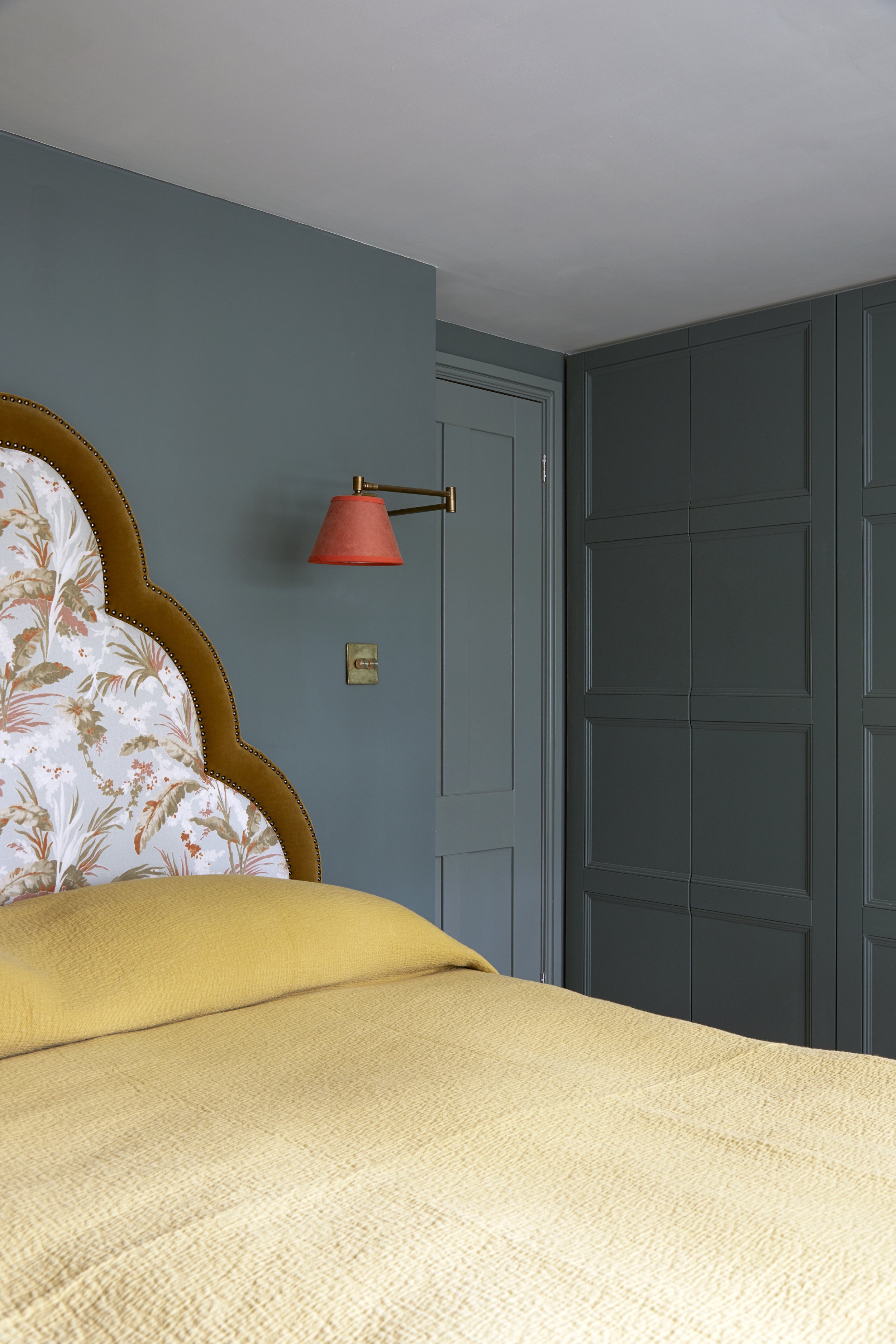 Teal bedroom with orange bedding interior designer Andrew Griffiths of A NEW DAY