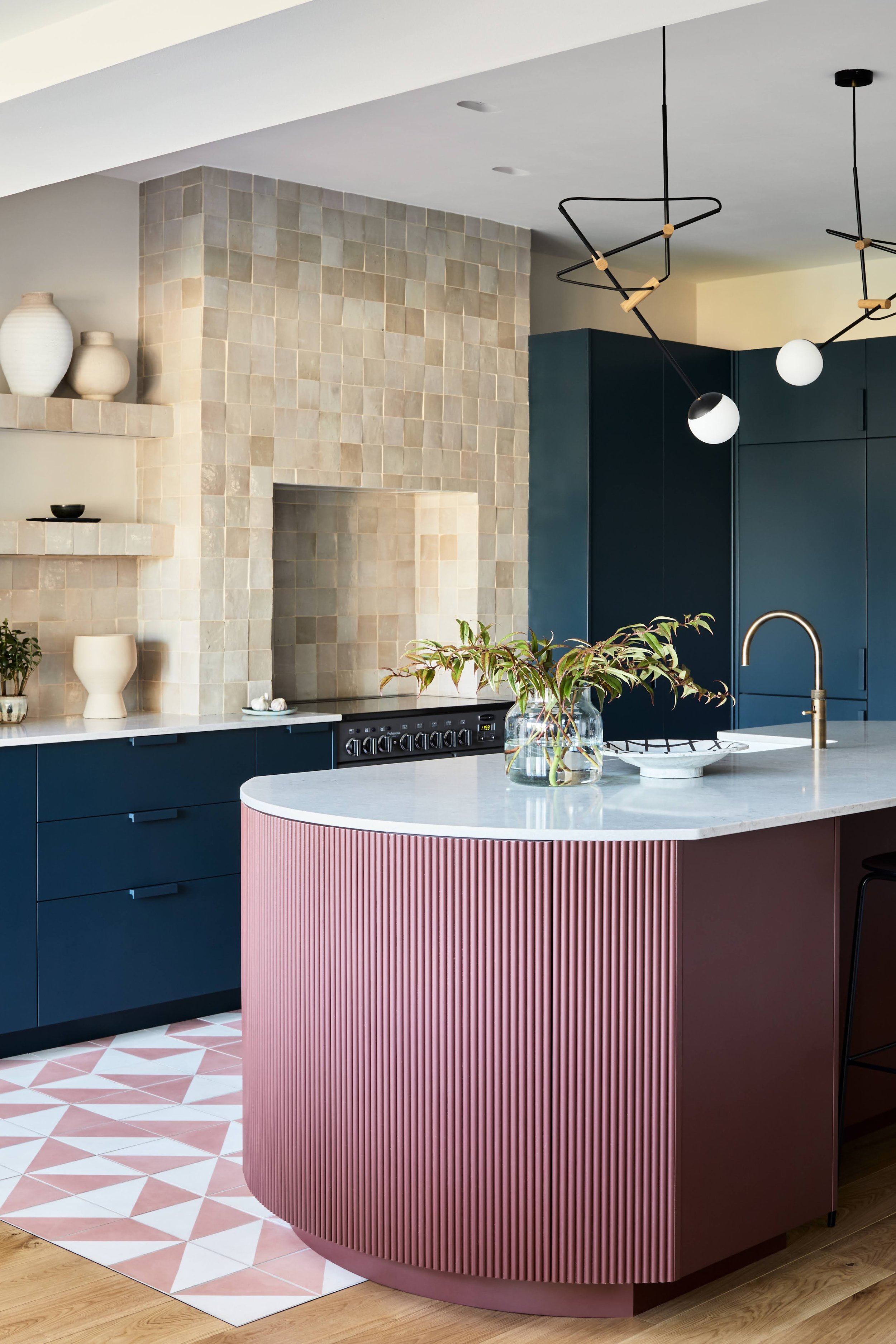 Dark blue contemporary kitchen with gold fittings by interior designer Andrew Griffiths of A NEW DAY