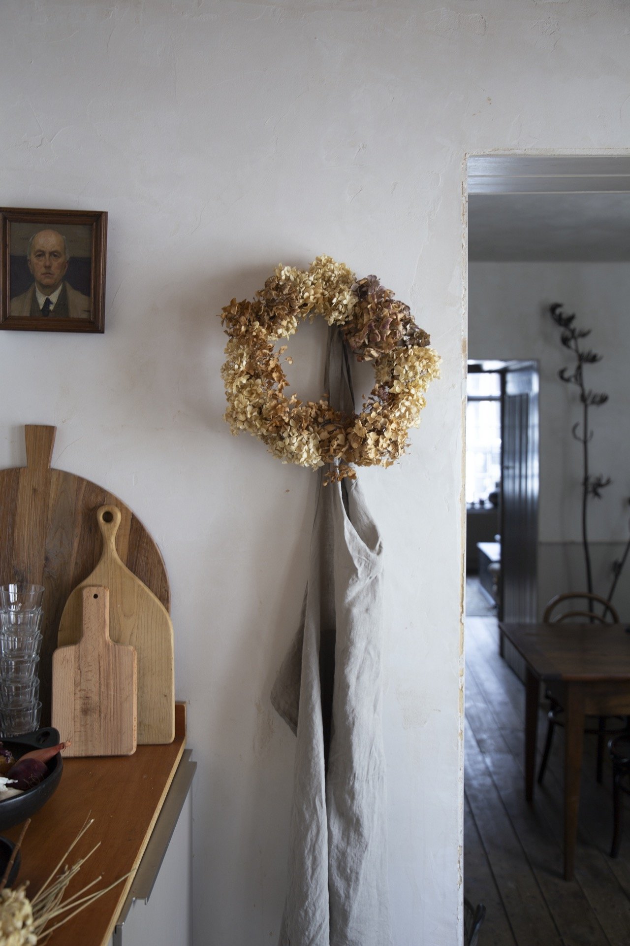 Wreath of dried hydrangeas hanging in a kitchen