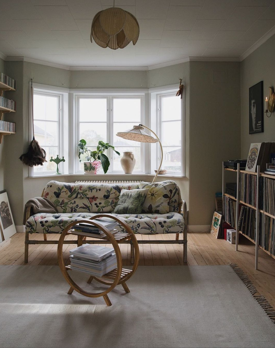 Living room in Swedish home with floral sofa