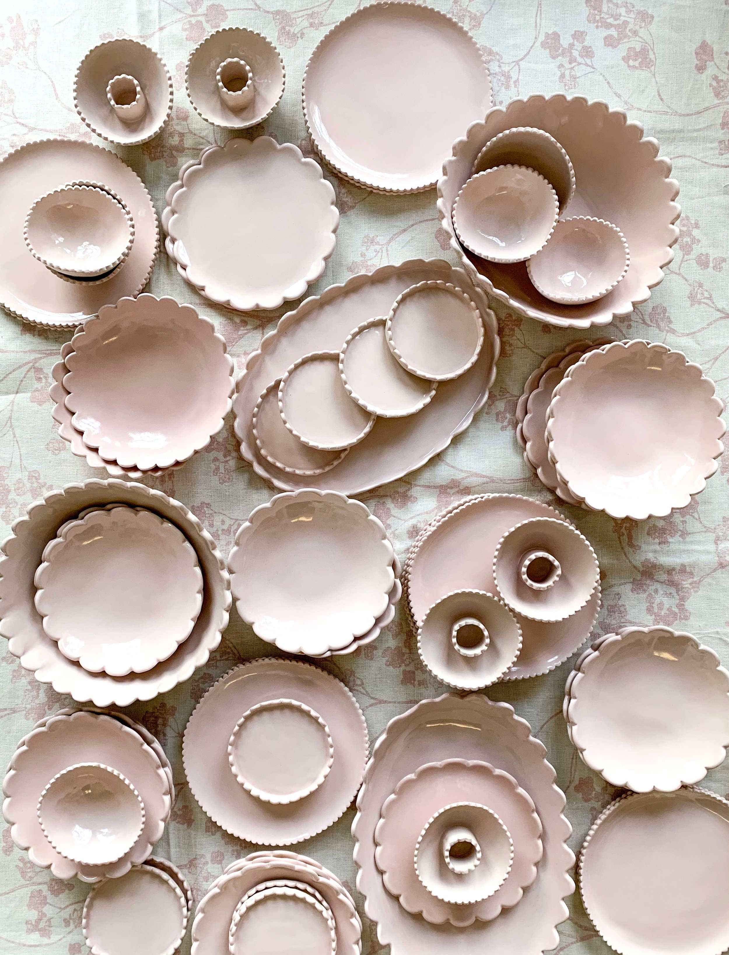 Pink scalloped plates and bowls by Karin Hassock Ceramics