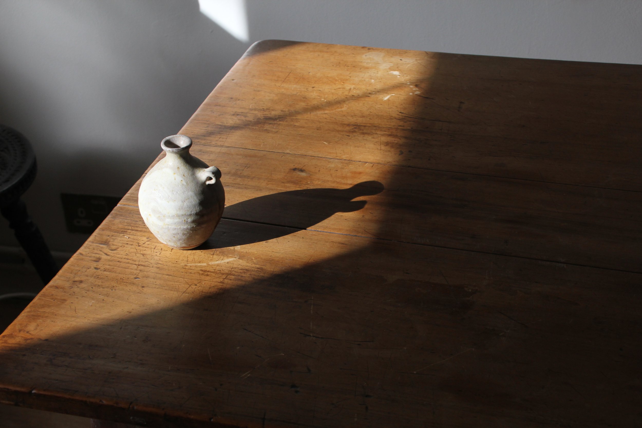 Small handmade pot in the sunlight, by Lily Pearmain