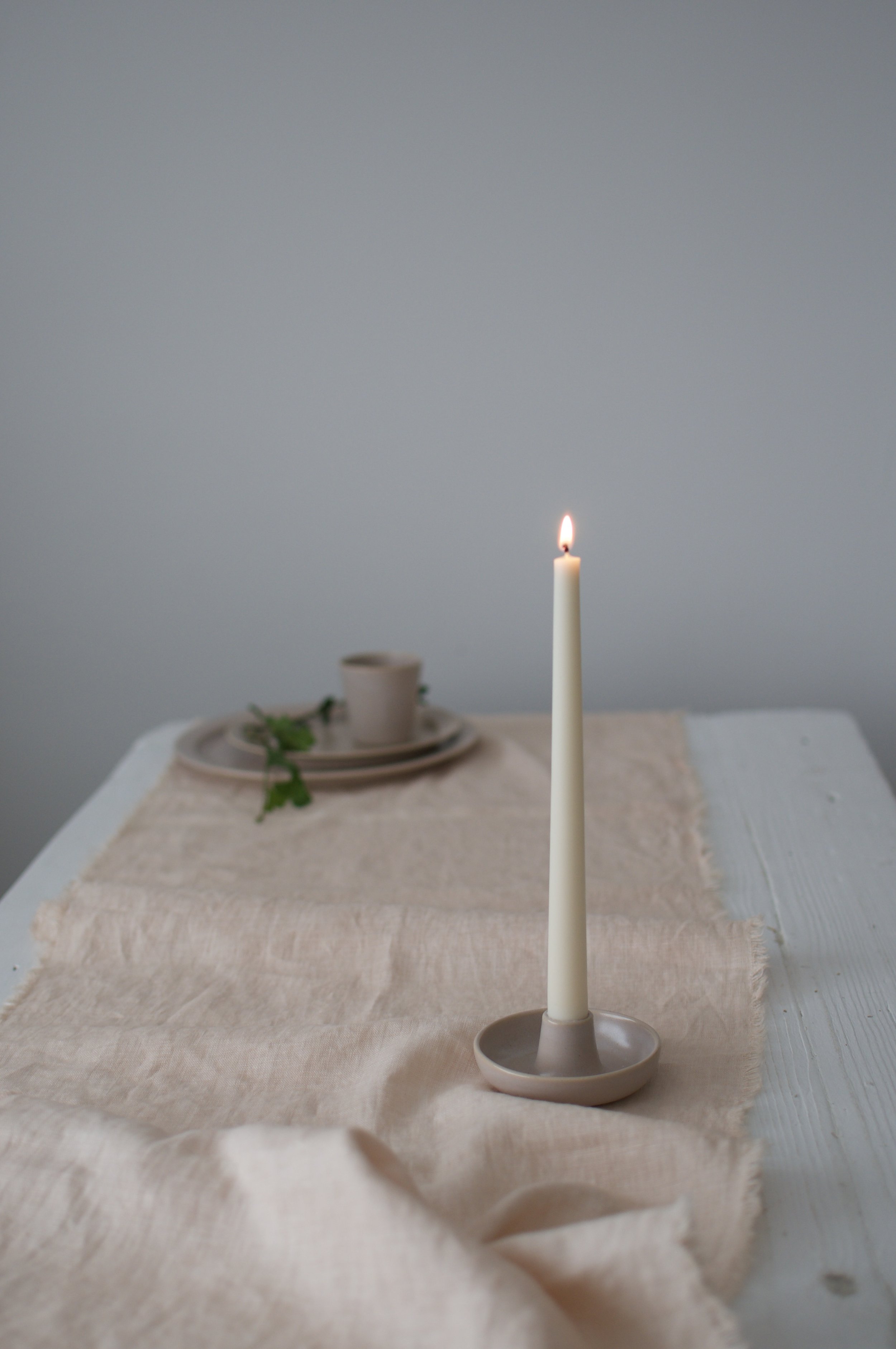 pale pink candle holder on pink linen fabric Makiko Hastings