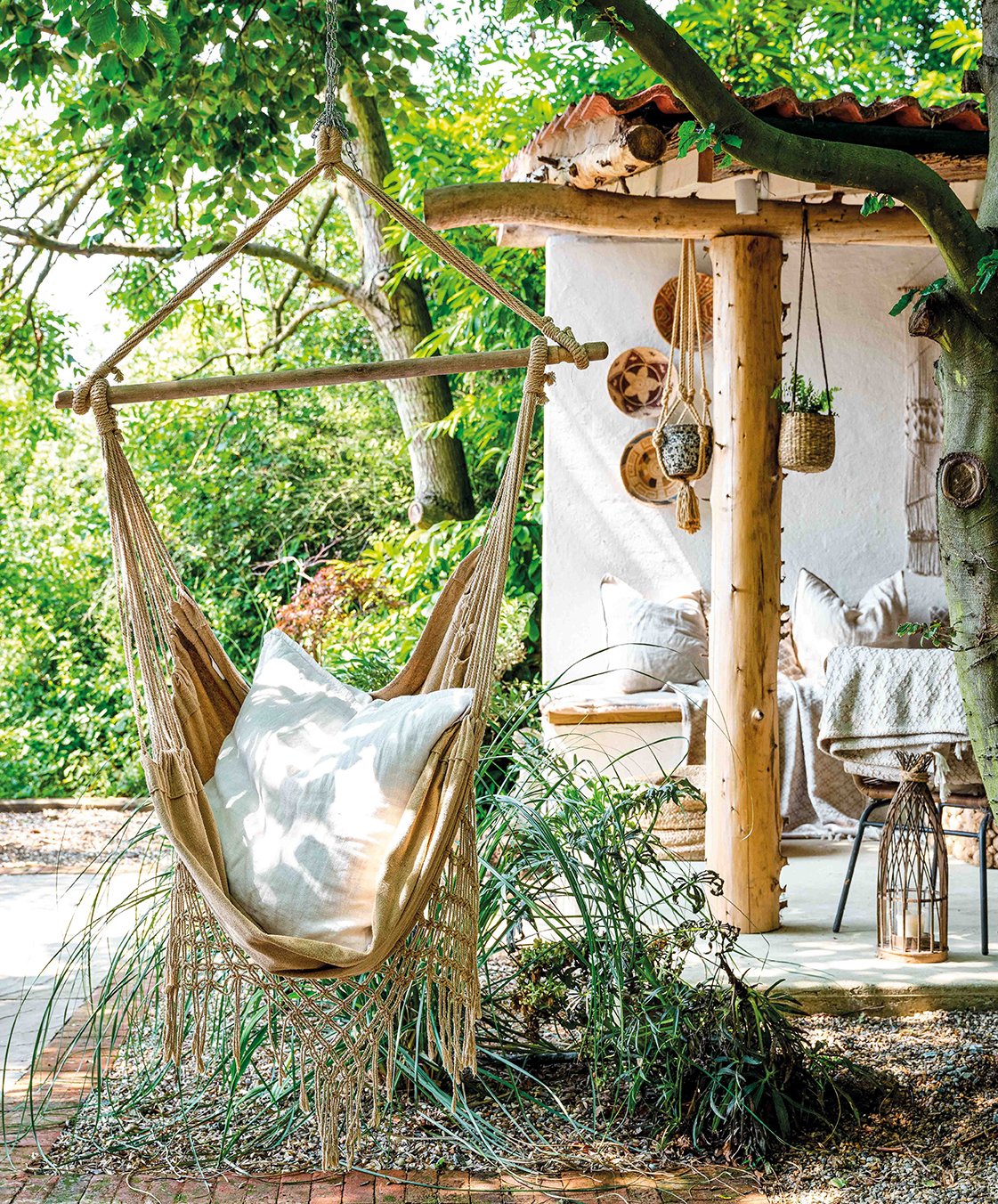 Hanging hammock chair in a bohemian style outdoor space