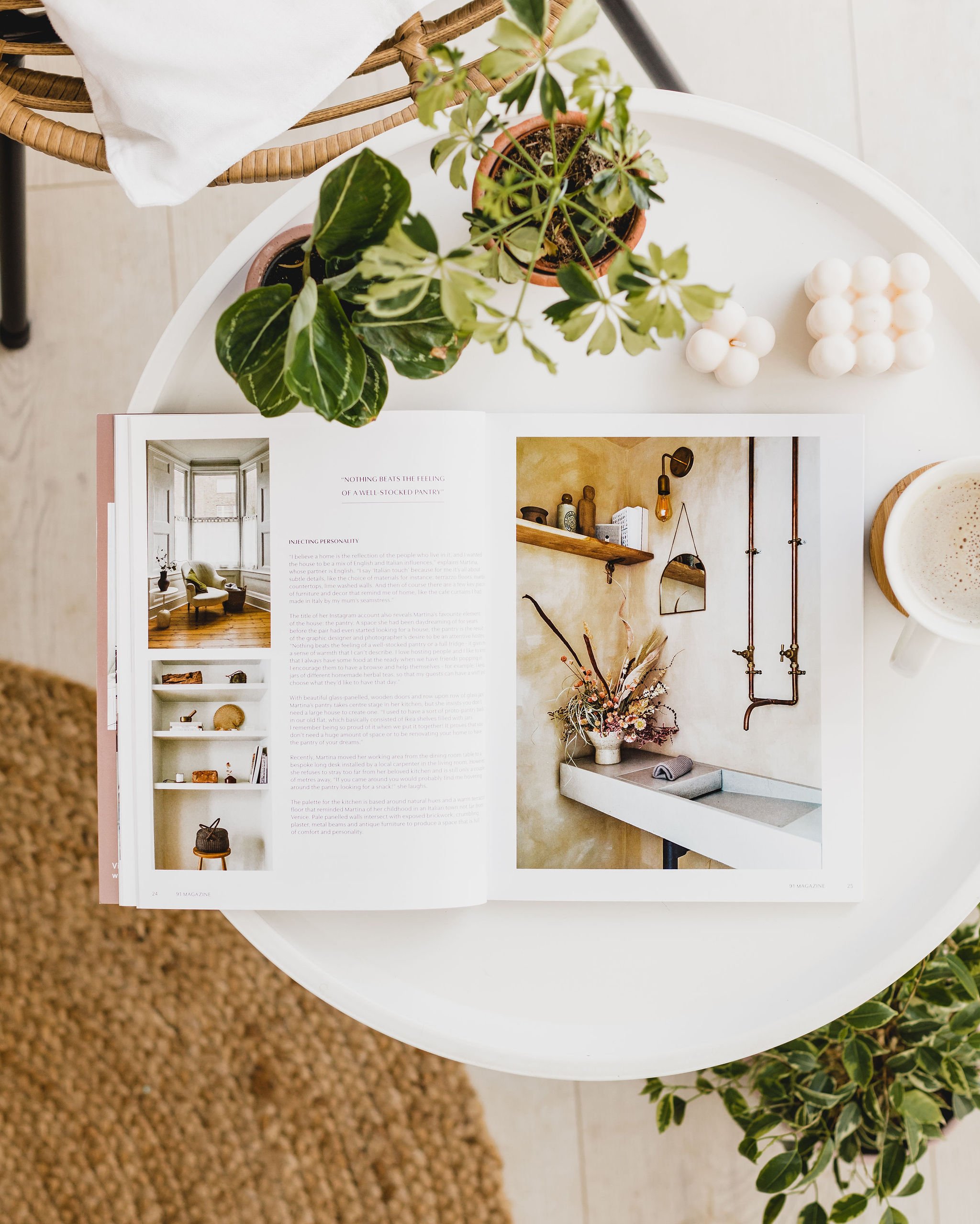 Interiors magazine 91 Magazine open on a white coffee table