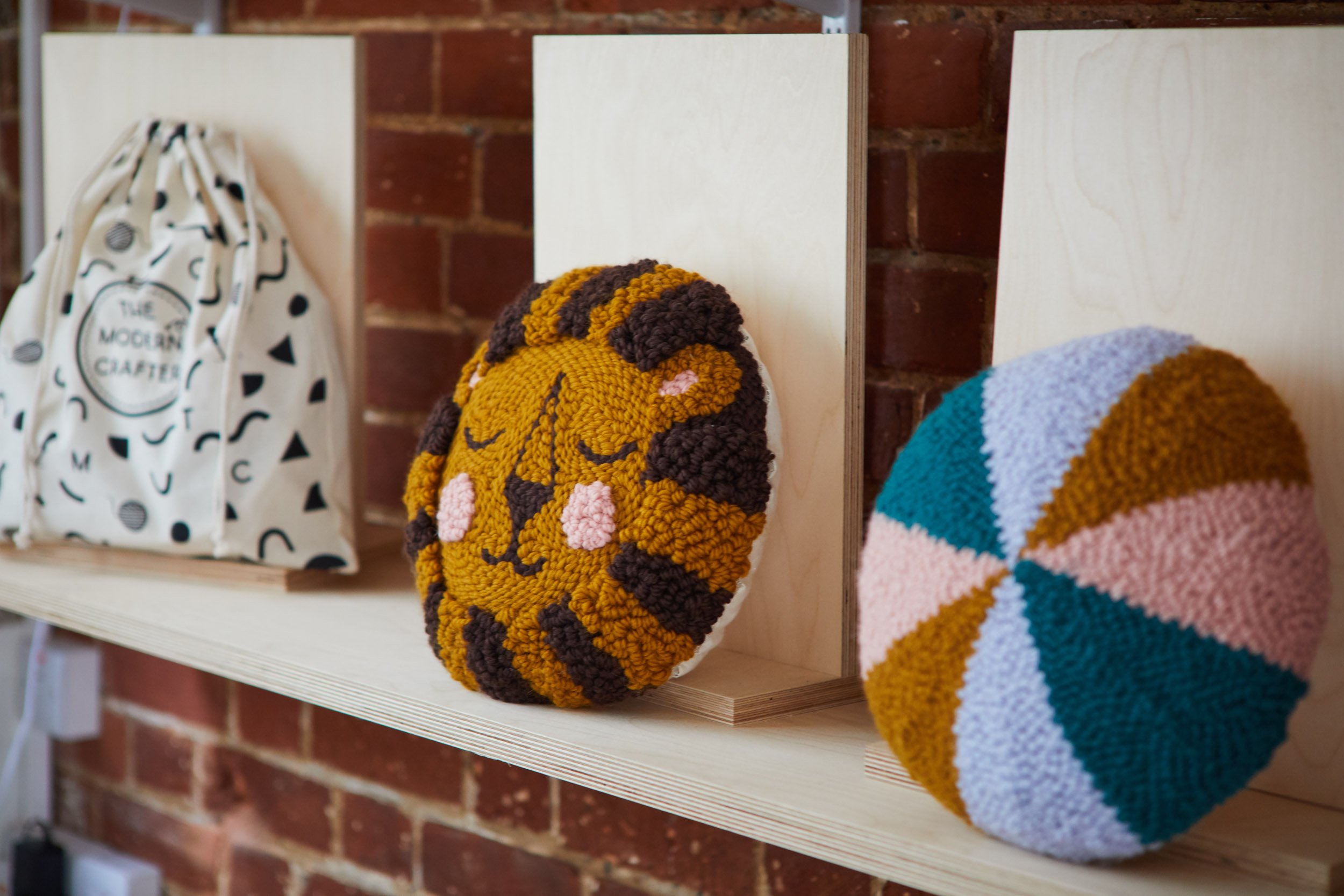 Lion punch needle cushion in The Modern Crafter store in Saffron Walden