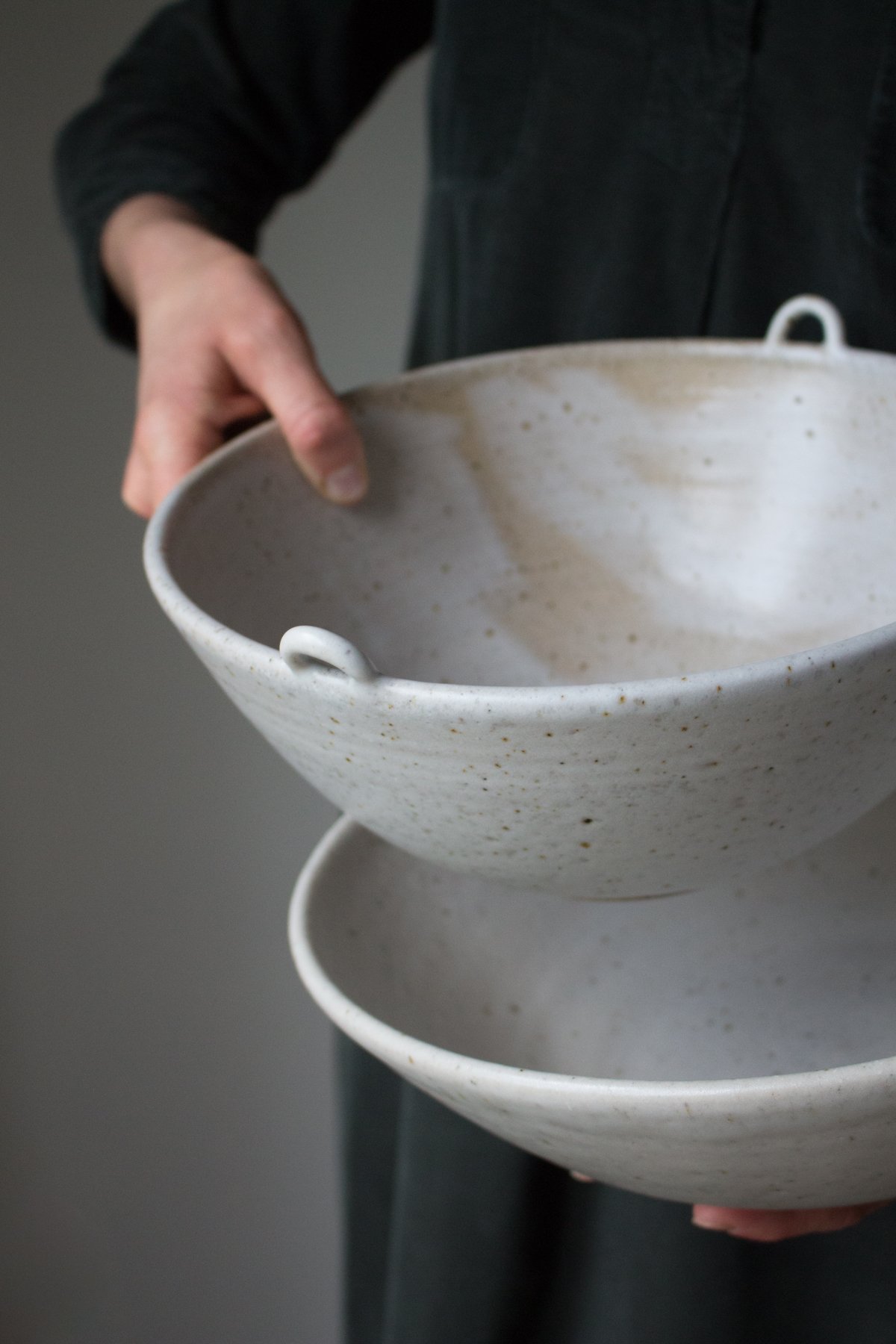 Maker Katie Coston of Illyria Pottery holds her homemade ceramic kitchenware