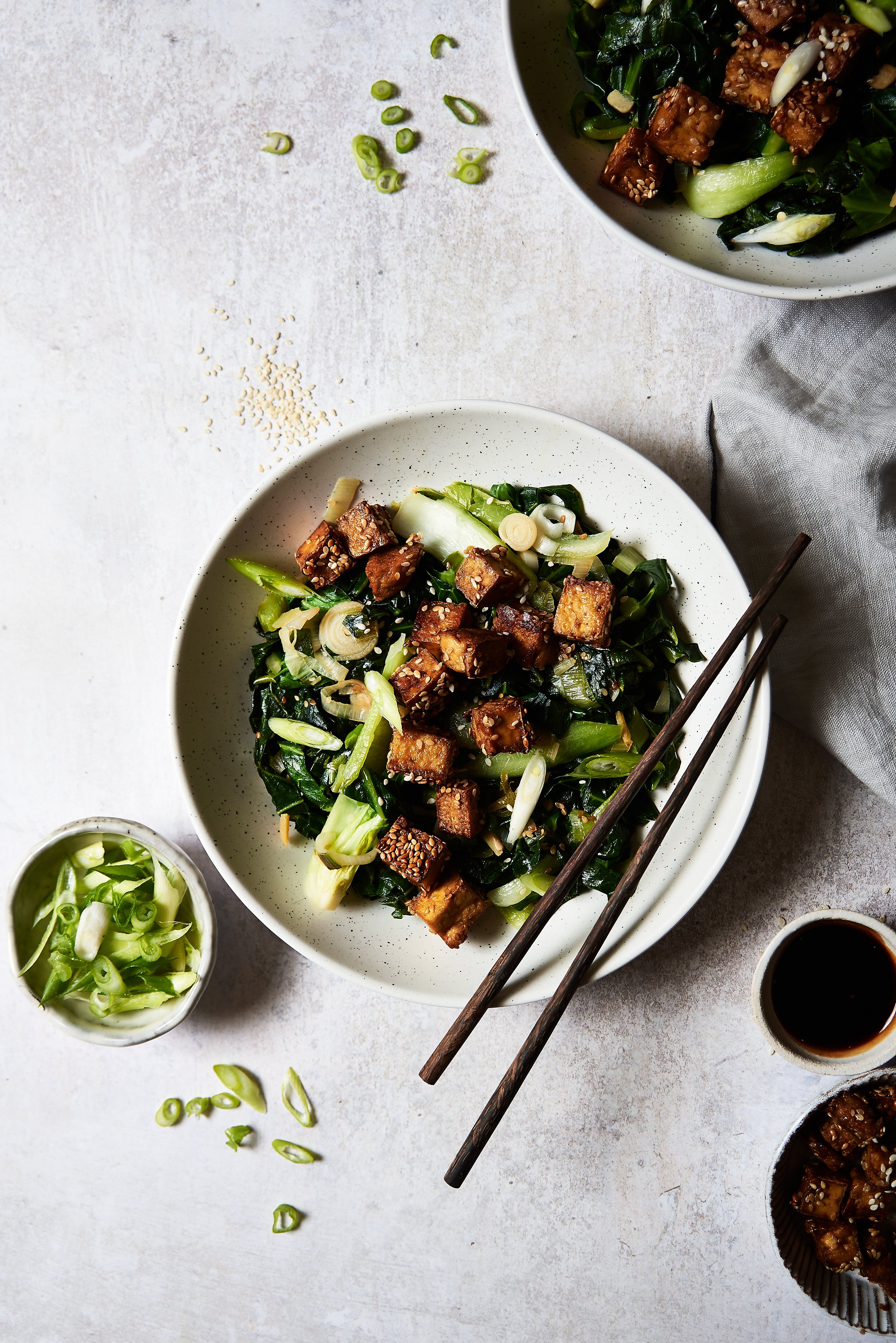 A bowl of spring greens and tofu