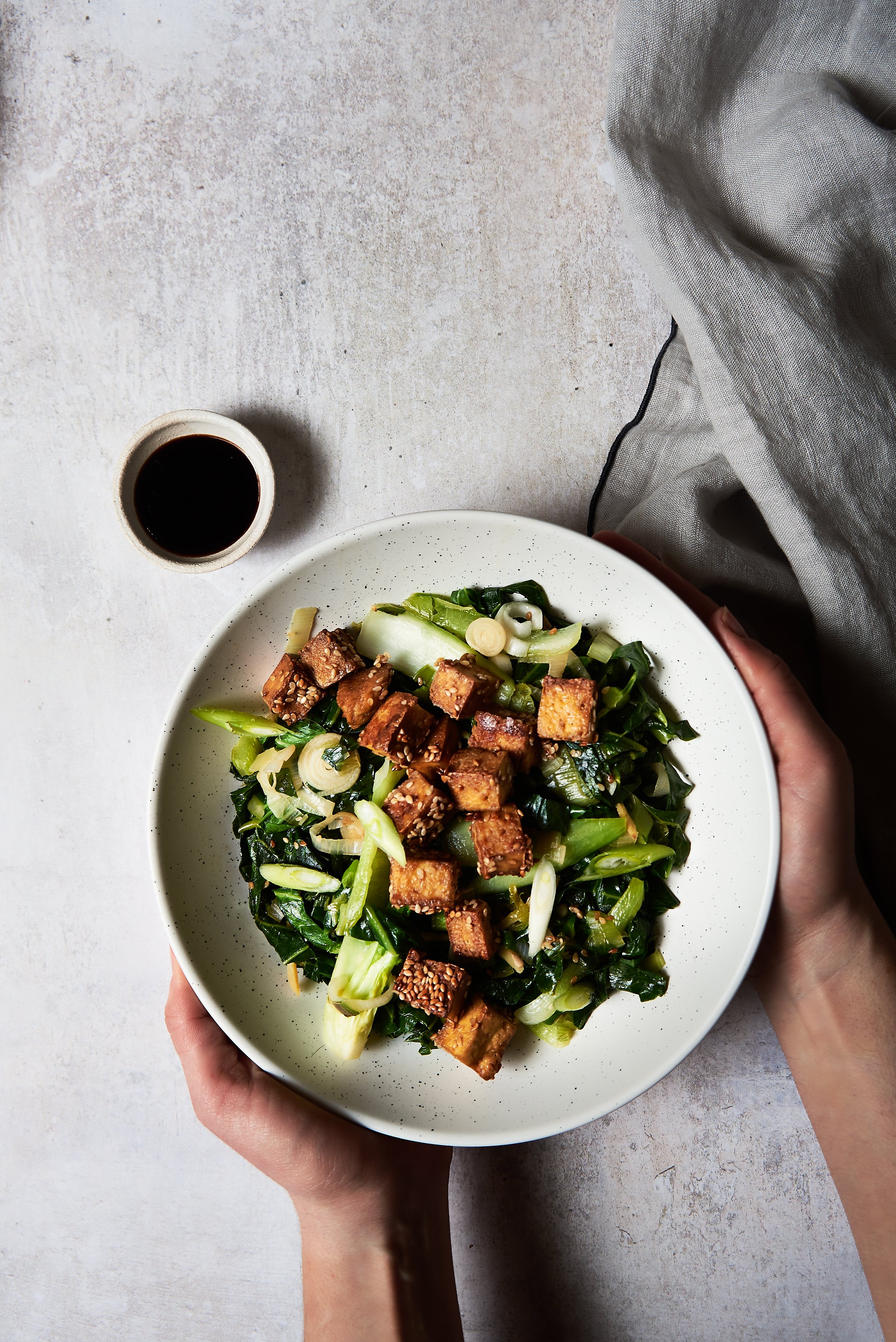 bowl of spring greens and tofu