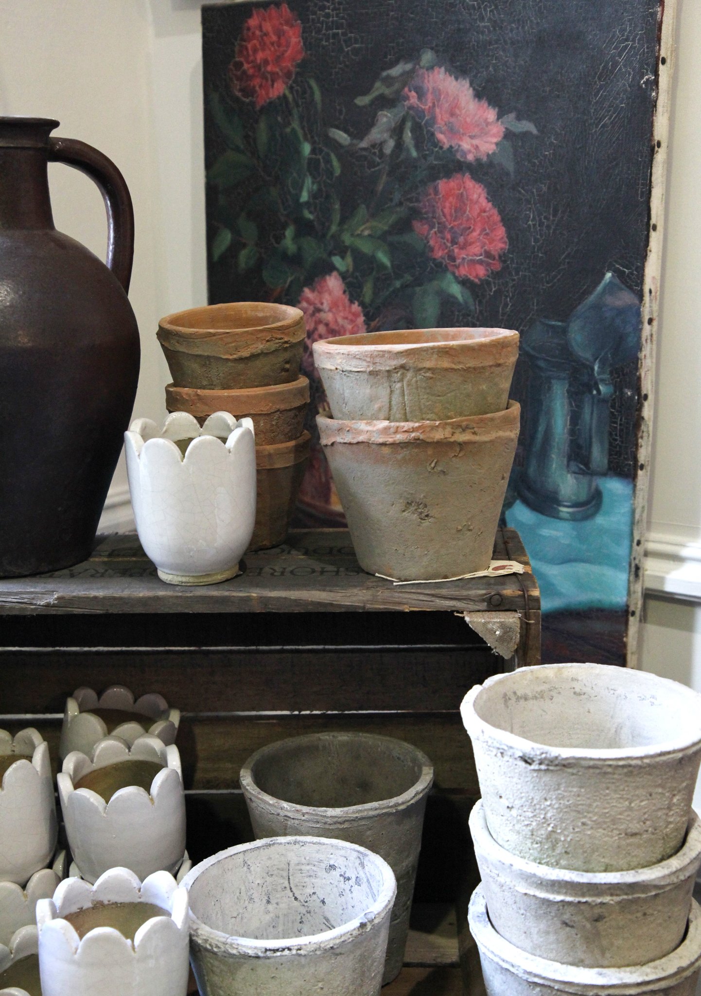 Oil painting and vintage plant pots inside vintage interiors store Domestic Science
