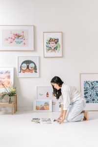 Anita Cheung of Neets laying out her paper prints in her Vancouver studio