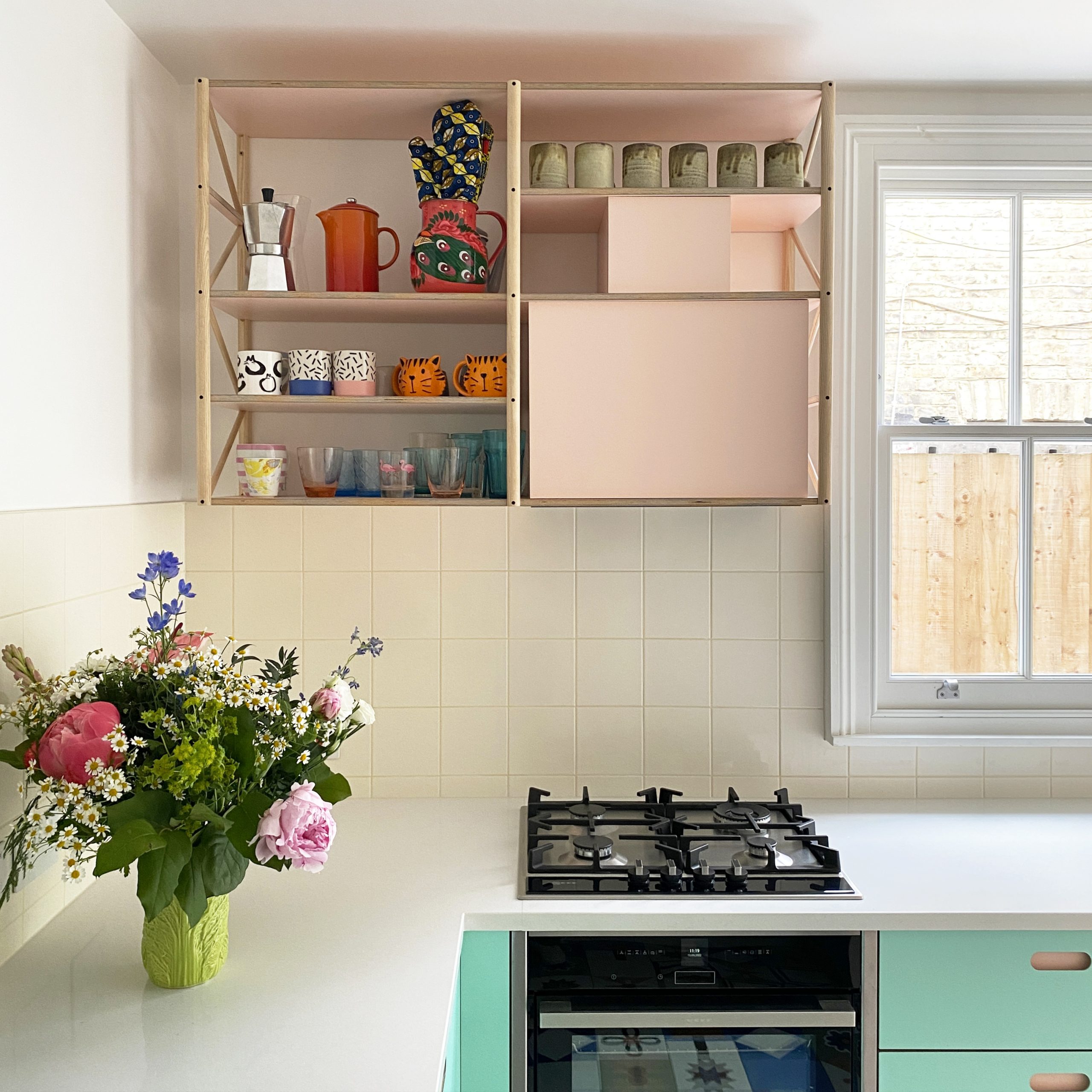 Minimal pink and mint kitchen created by independent kitchen designers Pluck