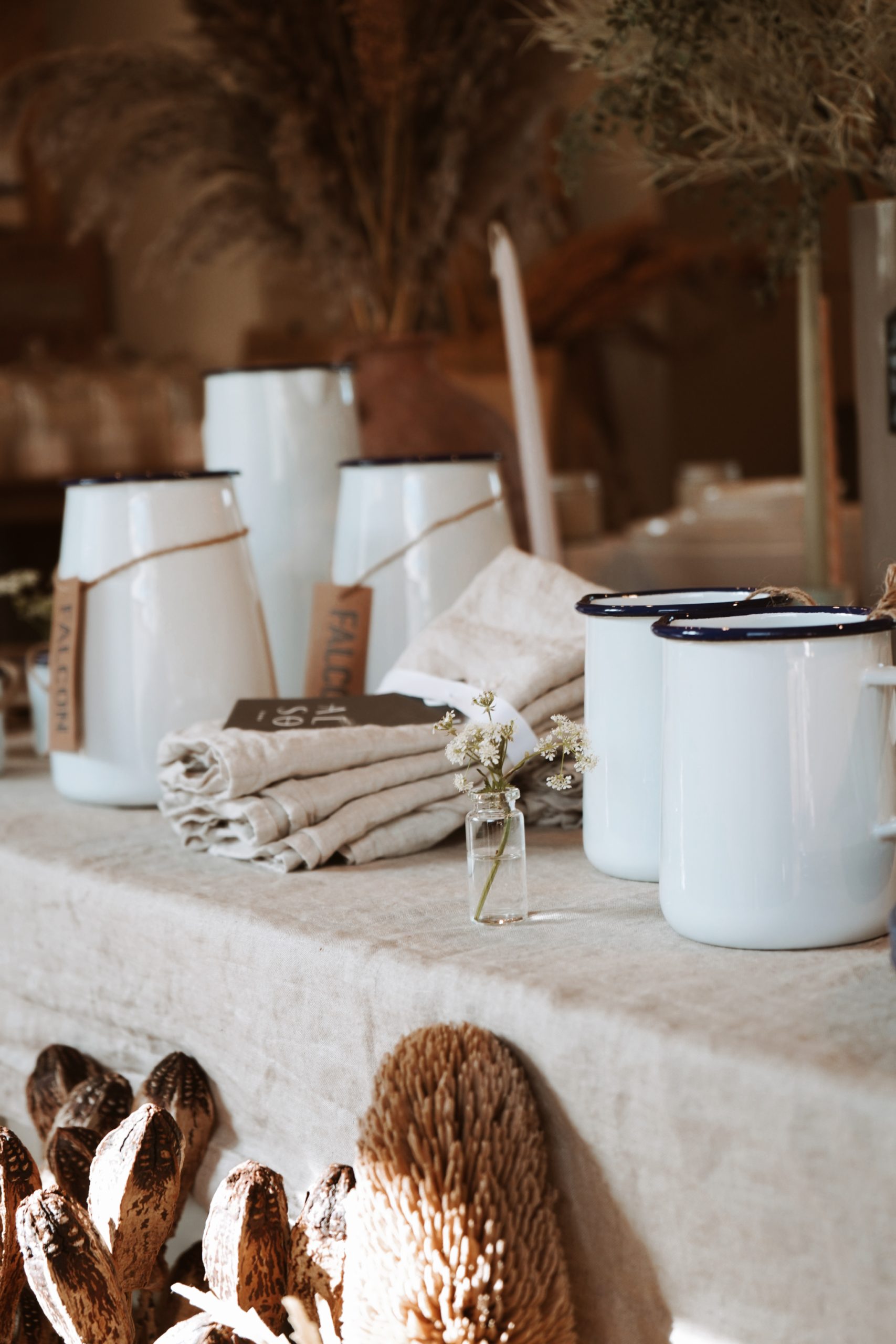Minimal ceramic vases and enamel cups inside Croft and Clay independent lifestyle store in Kent