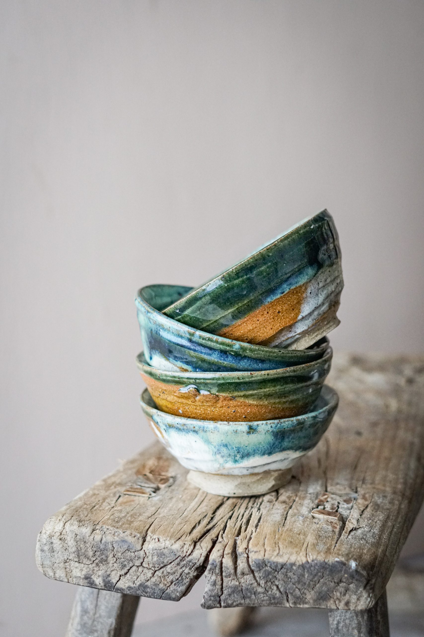 Blank Earth Ceramics blue, white and yellow bowls stacked