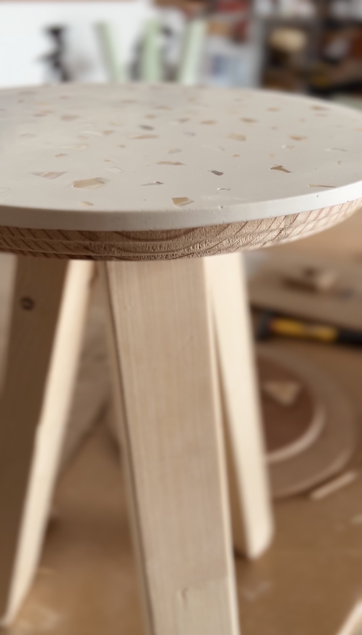 Handmade terrazzo topped wooden stool created by artisanal furniture makers The Limoncino