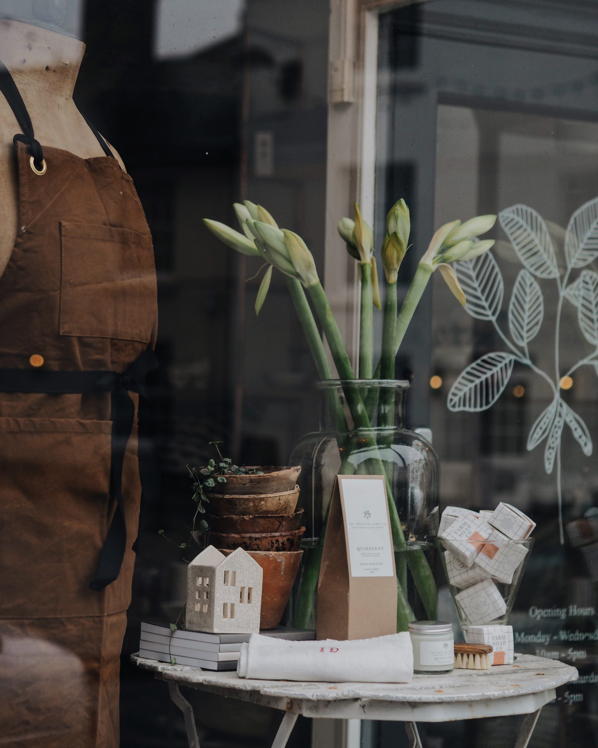 Window display with British made products of The Botanical Candle Co. in Shaftesbury, Dorset