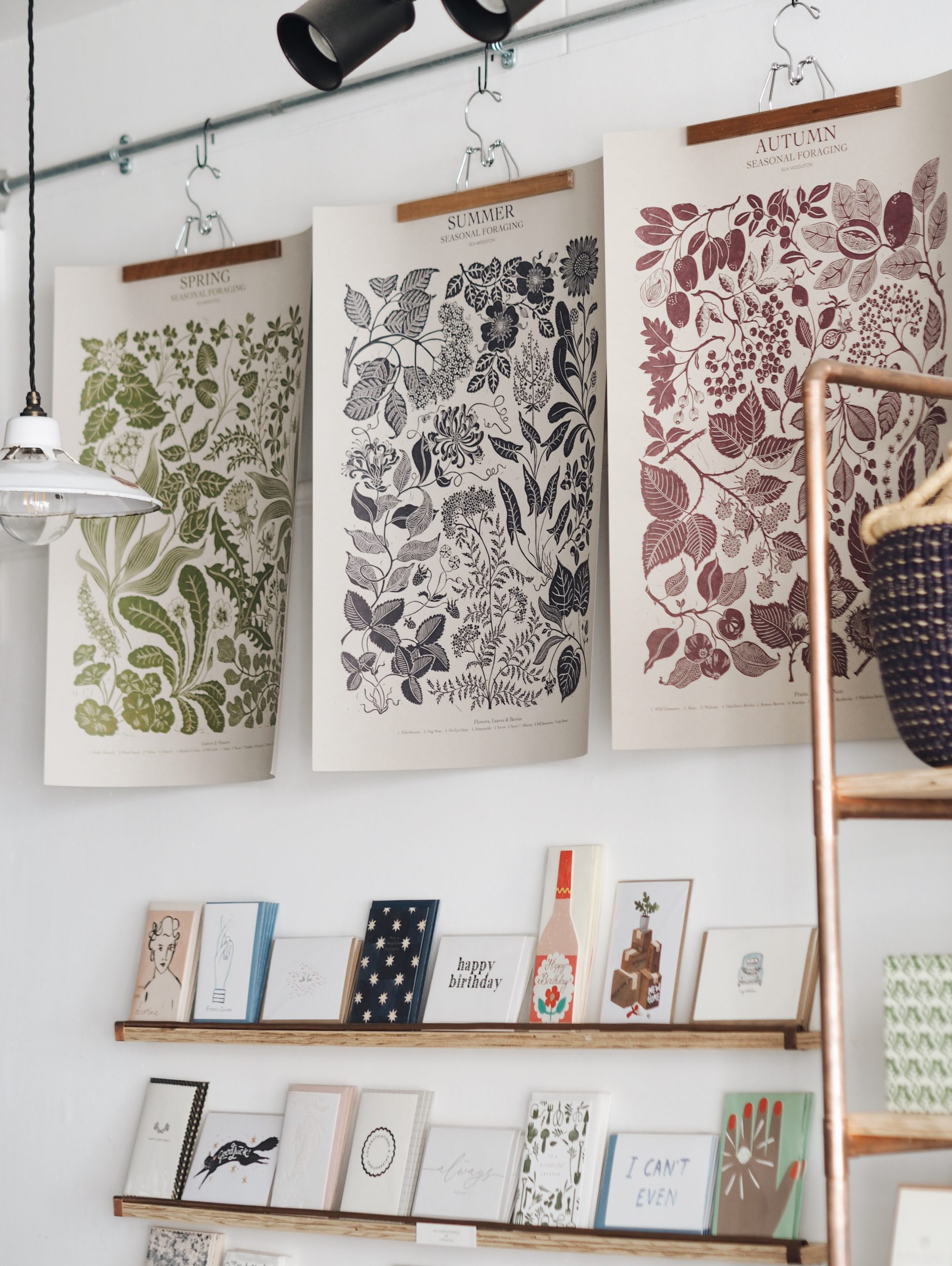 Botanical season prints inside independent store The Botanical Candle Co. in Shaftesbury, Dorset