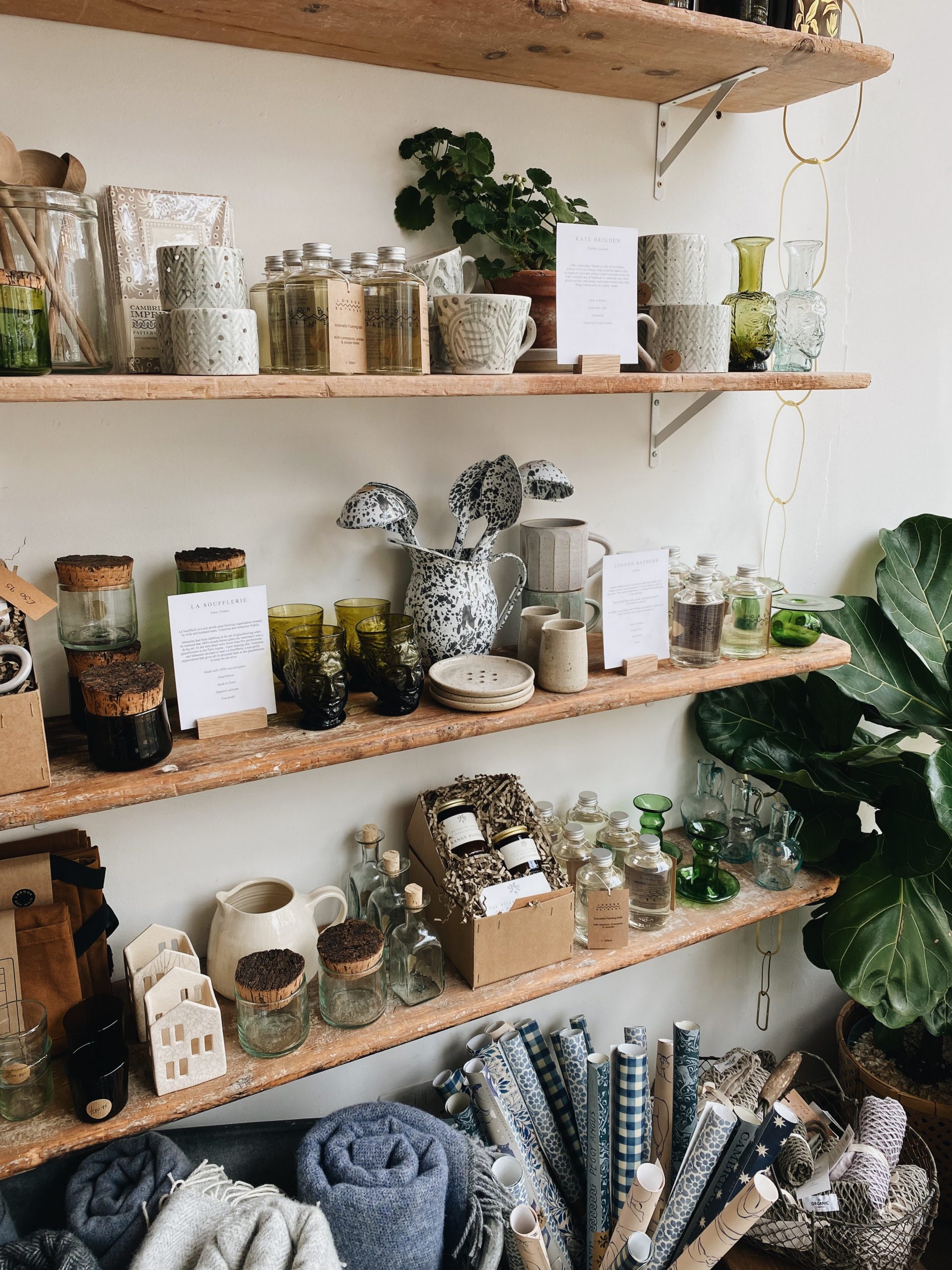 Candles, British ceramics and more on shelves inside independent store The Botanical Candle Co. in Shaftesbury, Dorset
