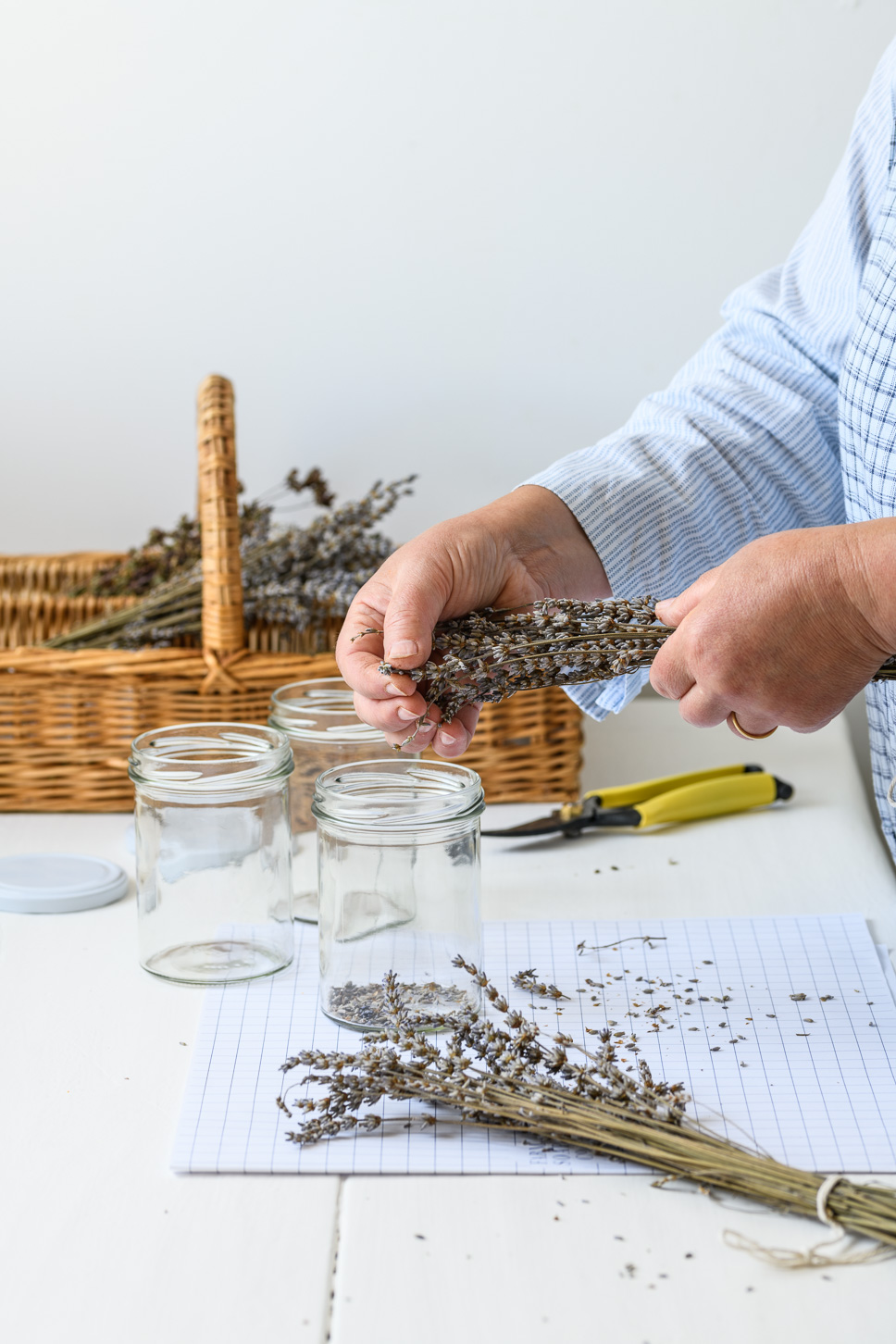 Natural skincare company owner Silvana de Soissons compliing dried herbs for storing