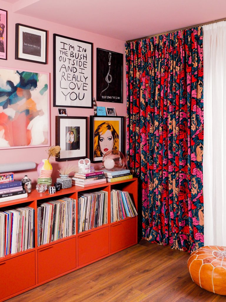 Inside Emma Jane Palin's pink living room with gallery wall and mid-century sideboard containing record collection