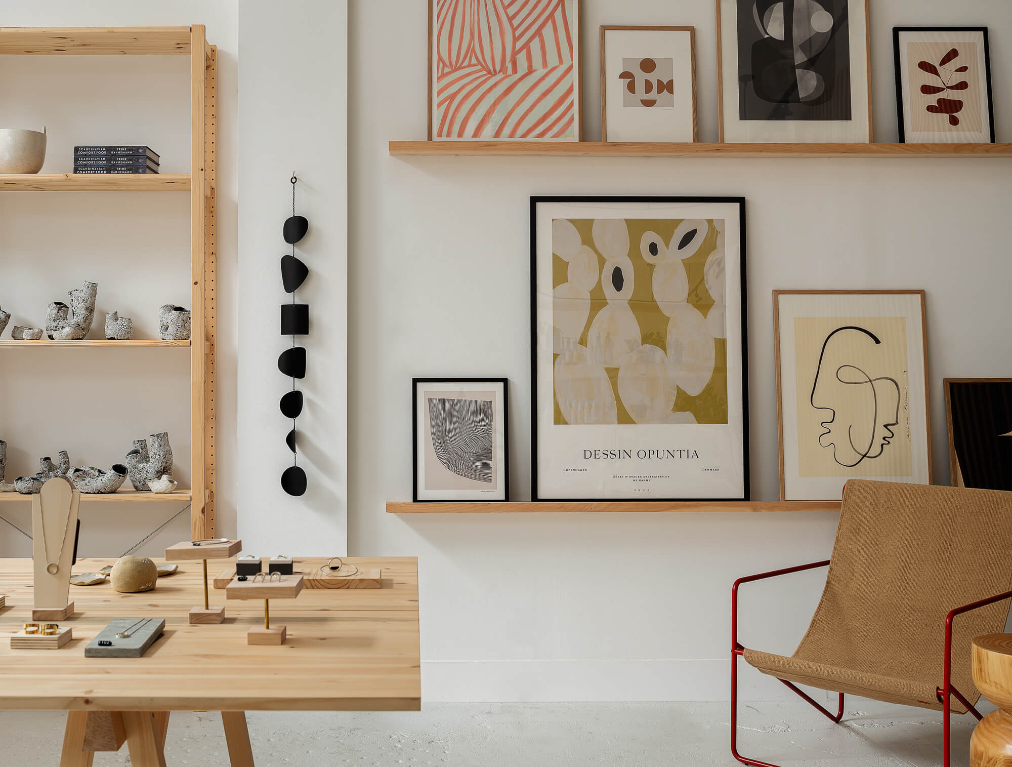Light wooden fixtures and artwork Inside scandi inspired homeware store Woodland Mod in Seattle