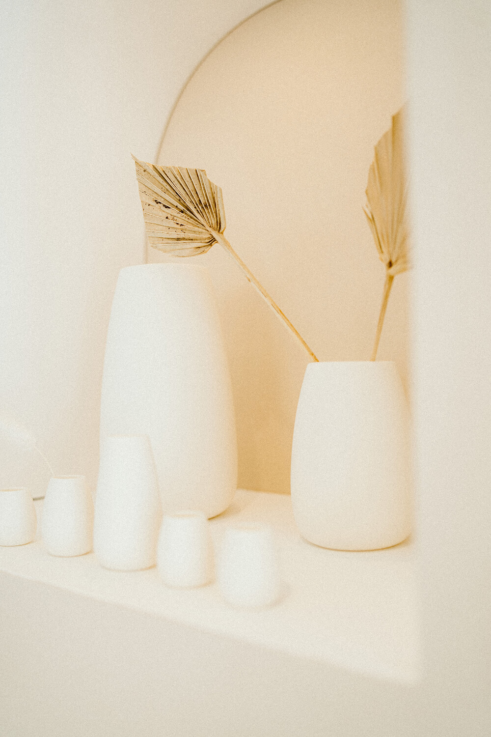 Minimal vases with dried flowers inside Rebecca Furze Jewellery, Totnes