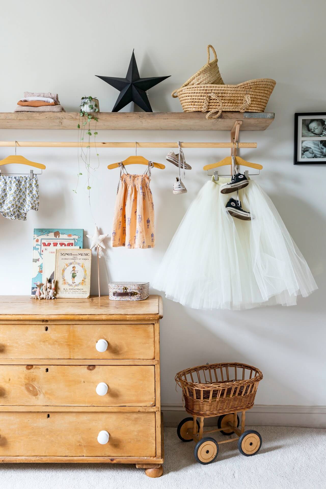Child's bedroom with vintage furniture and pretty object hanging up