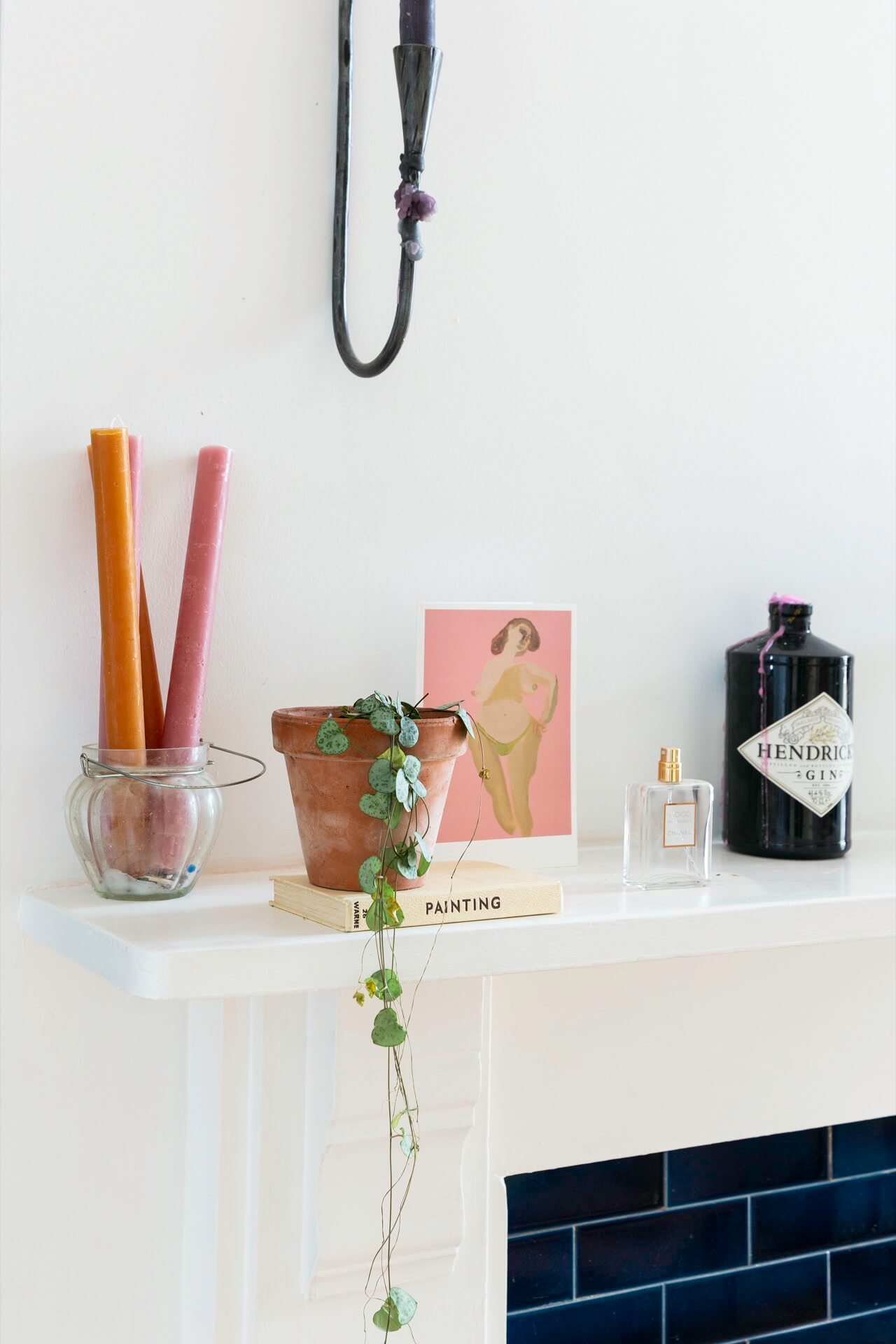 a mantelpiece styled with a few choice objects 