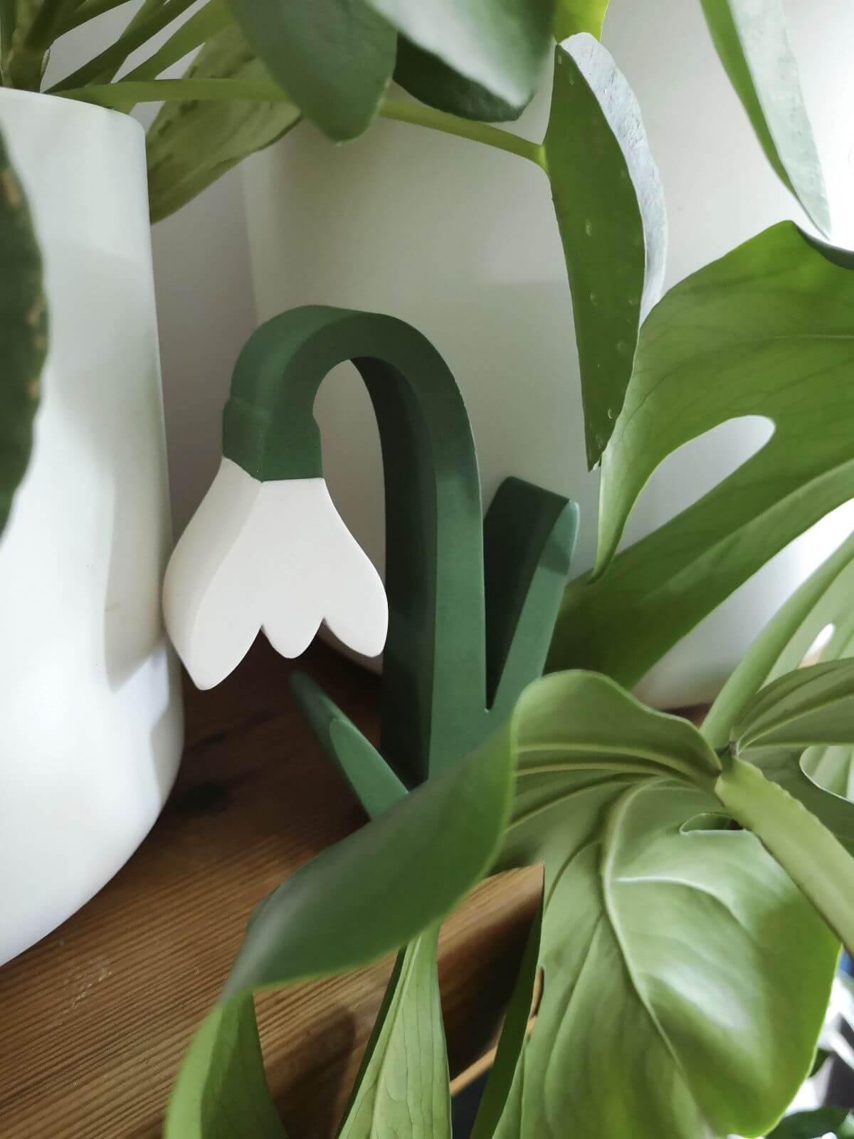Wooden white snowdrop flower inside illustrator and maker Taaryn Brench's colourful studio