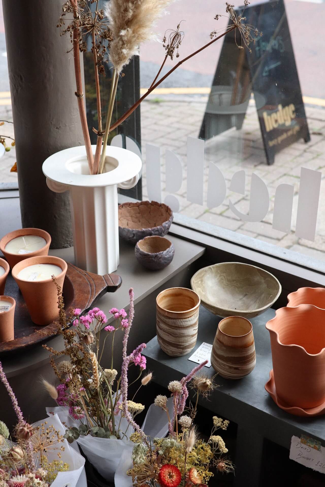 Bohemian interiors and homeware including terracotta pots and vases inside independent flower shop Hedge, Birmingham