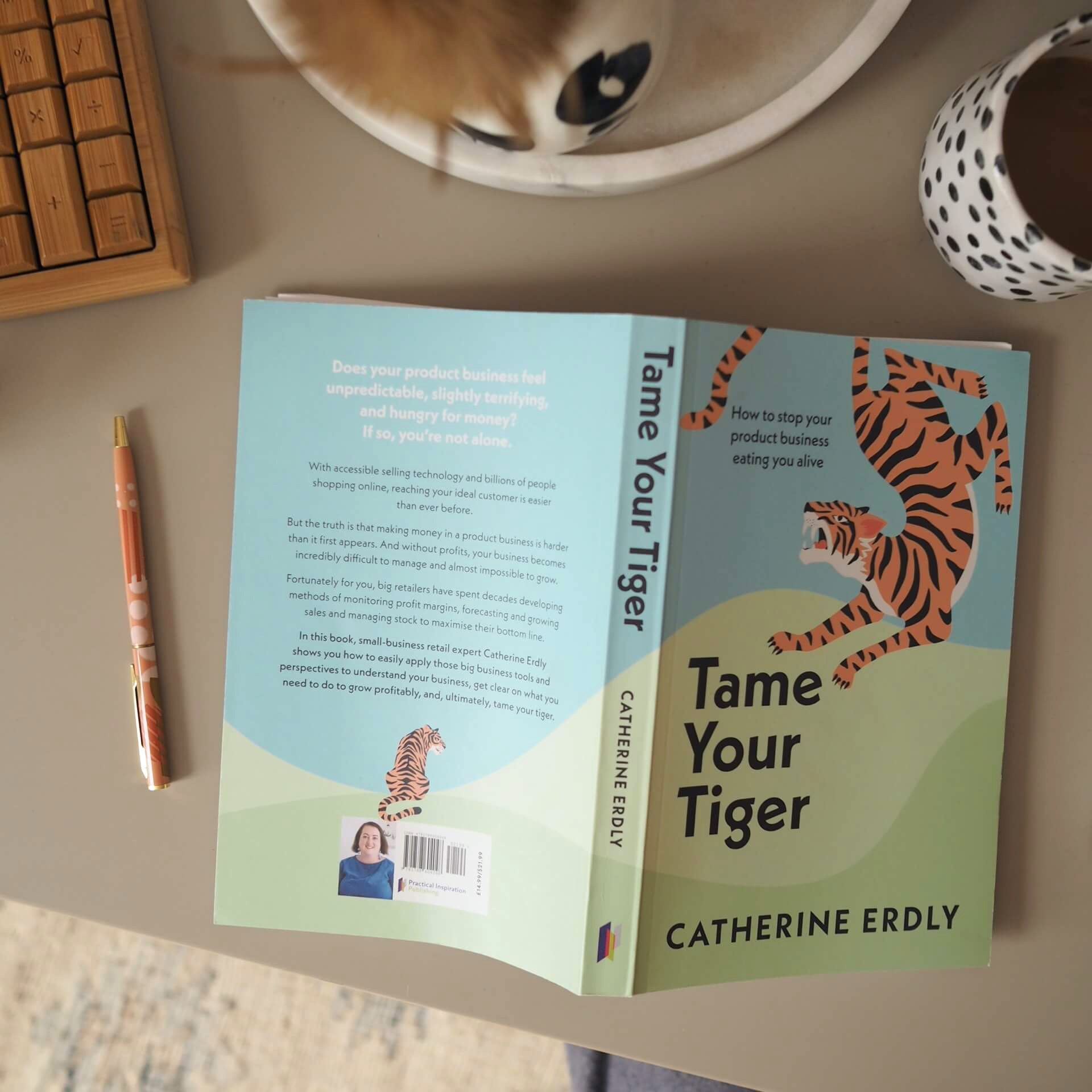 Small business book Tame Your Tiger: How to stop your product business eating you alive by Catherine Erdly on a table
