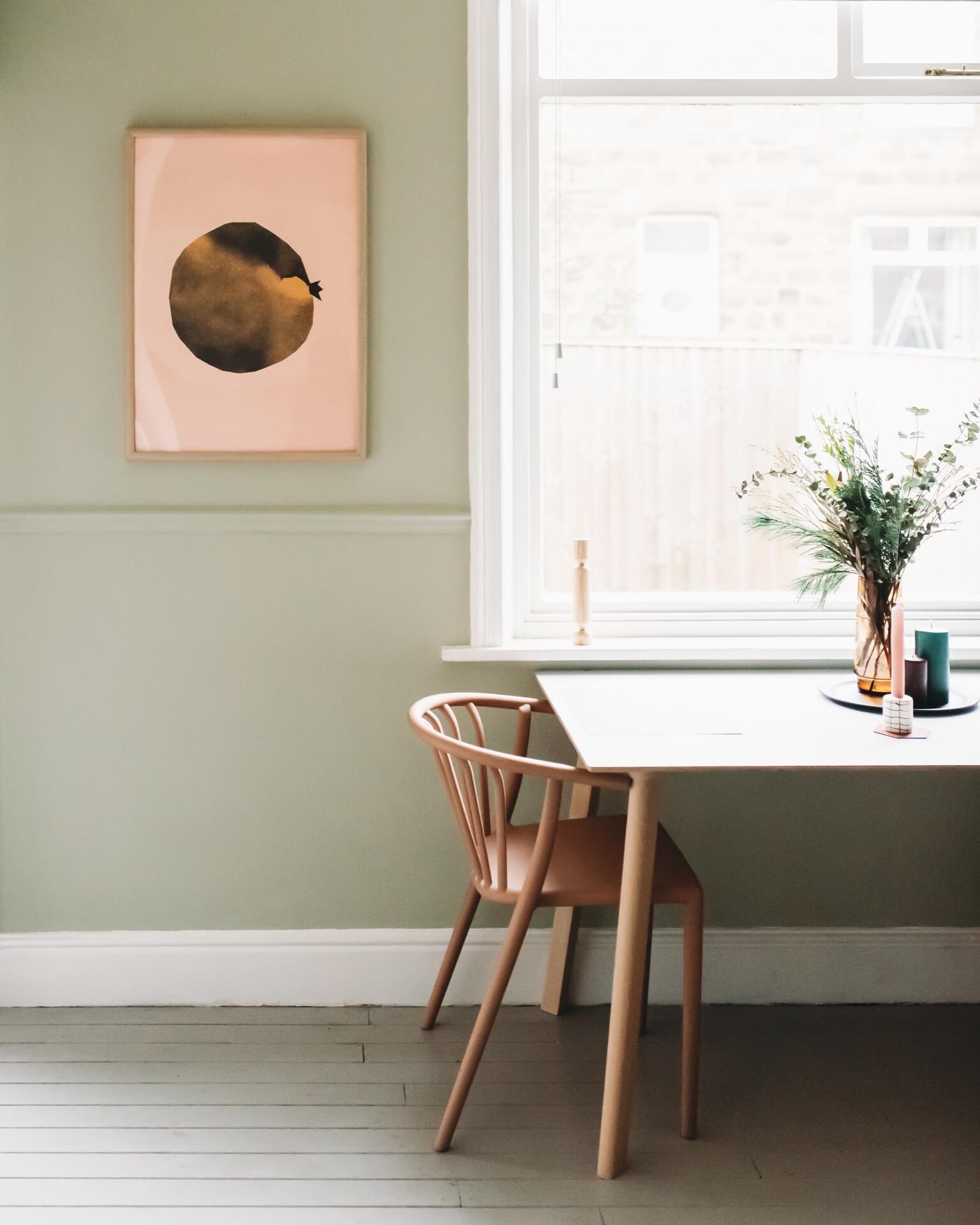dining table in front or large window, soft green walls 