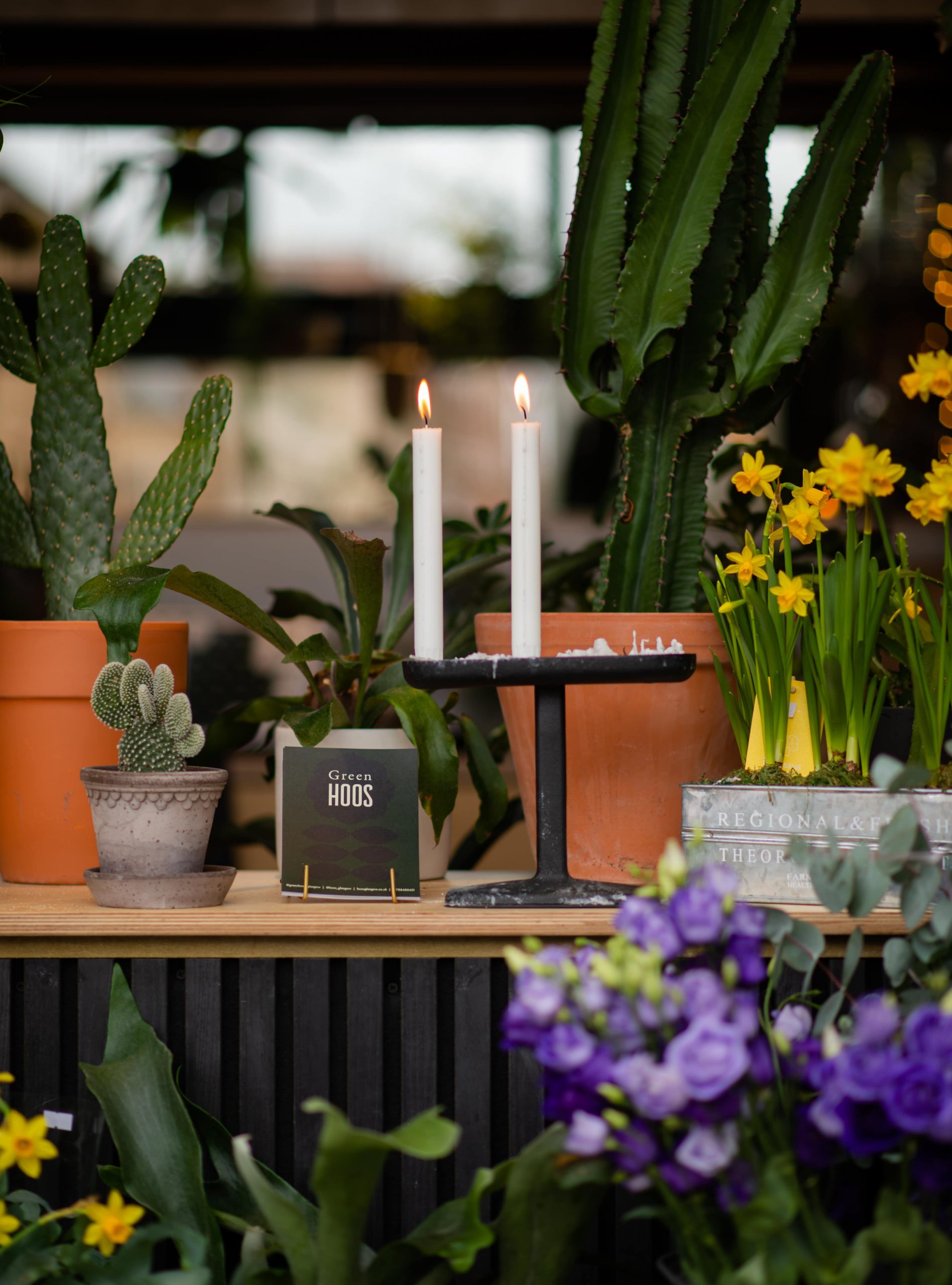 Spring flowers and candlesticks inside independent interior store Green HOOS Glasgow