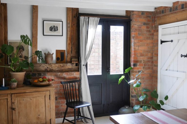 Period home interior with wooden beams, exposed brick and vintage furniture - home of Laura Jenkinson of Ticking Stripe Home