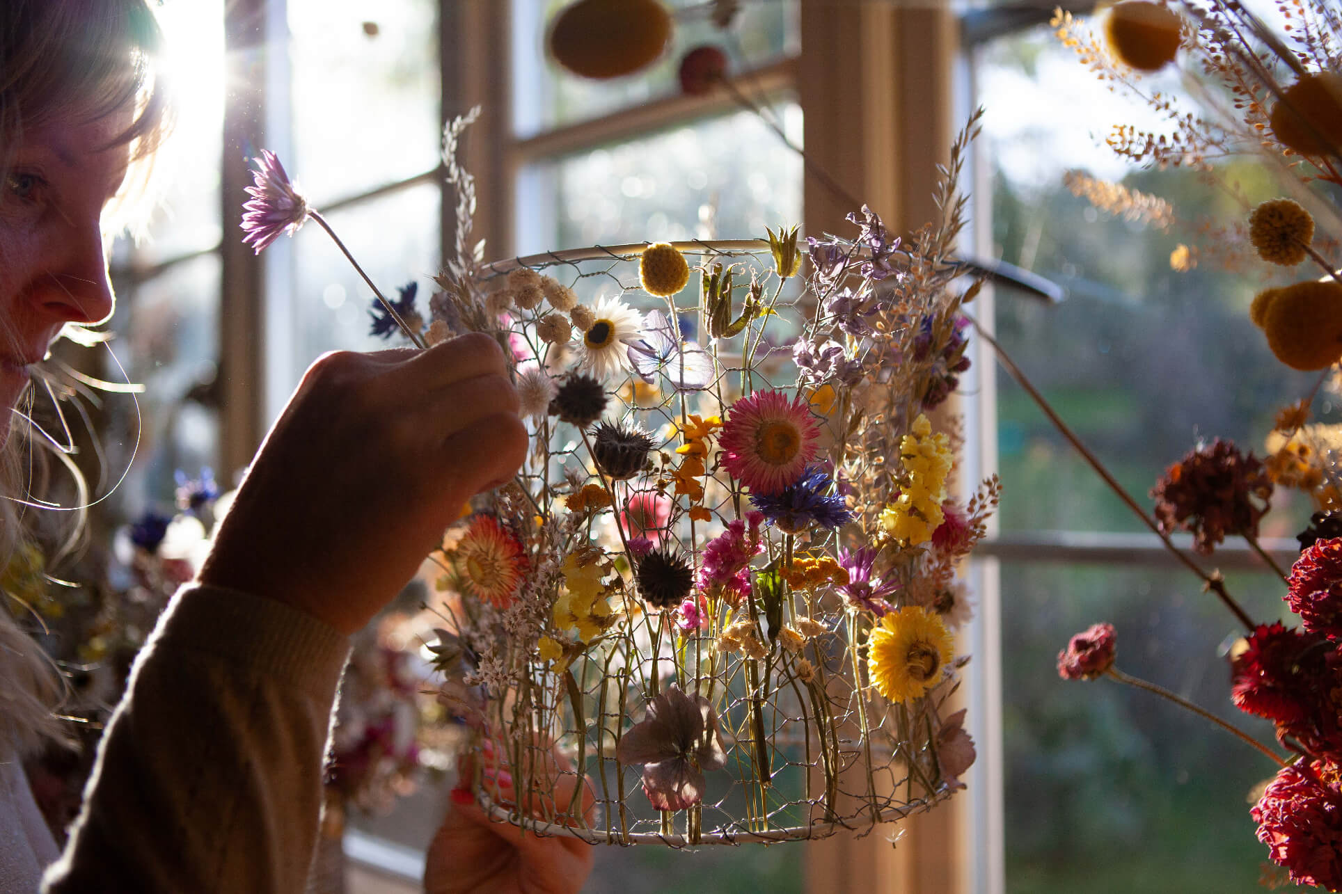 Sustainable interior everlasting floral sculpture designer Layla Robinson creating inside her Hay-on-Wye studio